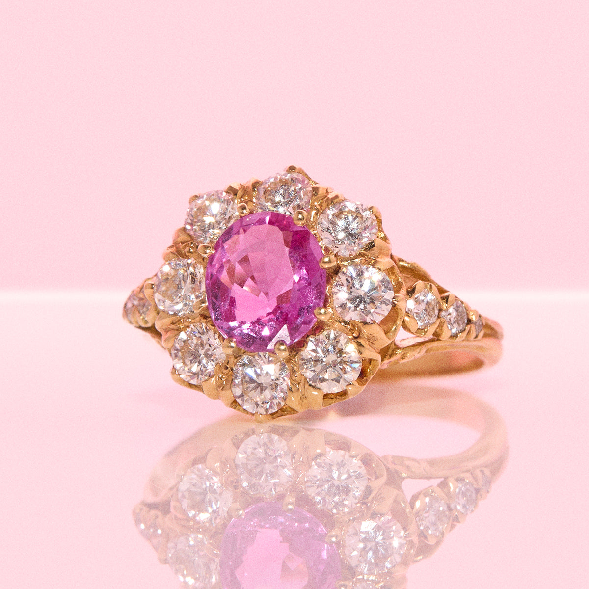 Vintage 18ct gold 1.16ct oval pink sapphire and 1.0ct diamond cluster ring