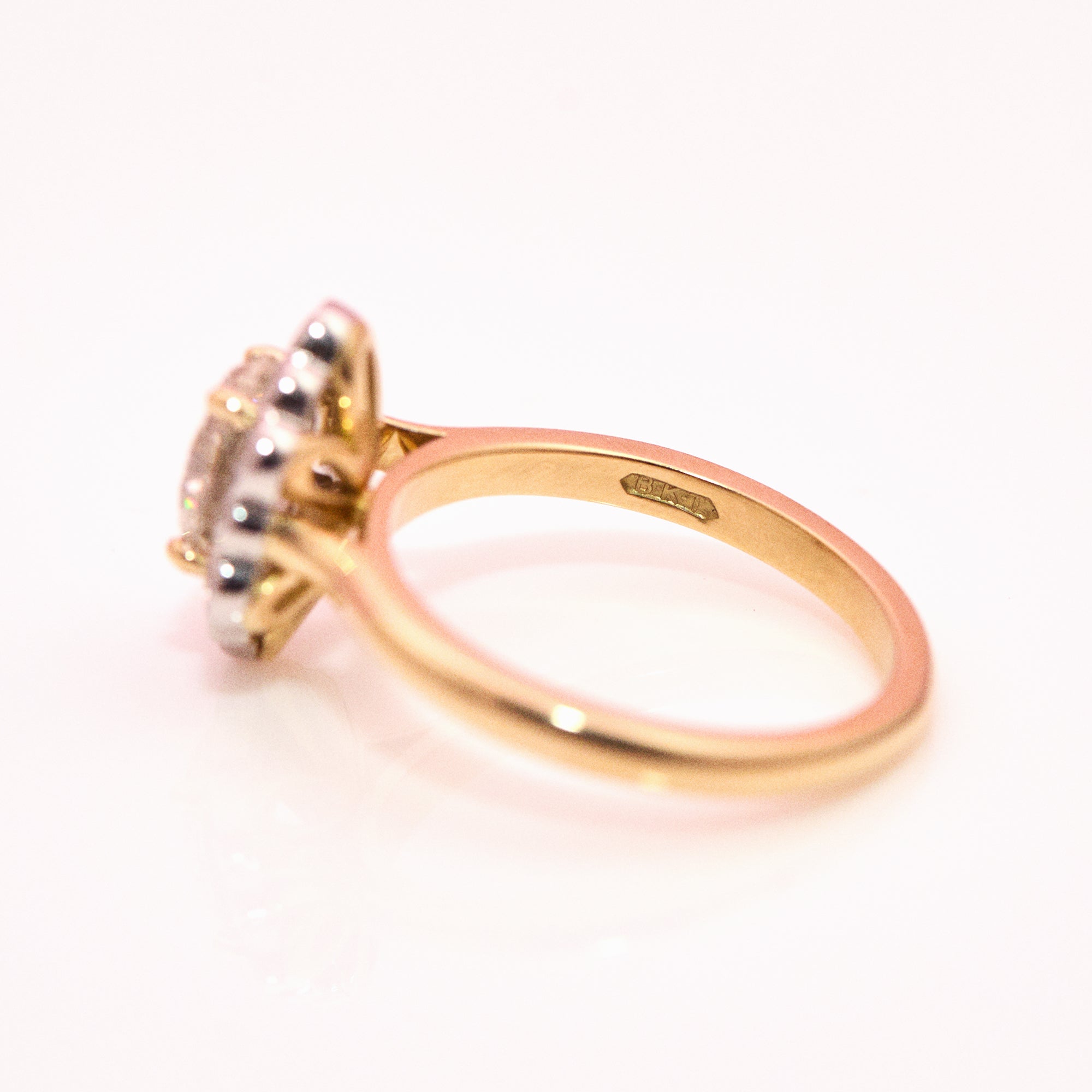 18ct gold 1.20ct oval diamond flower ring