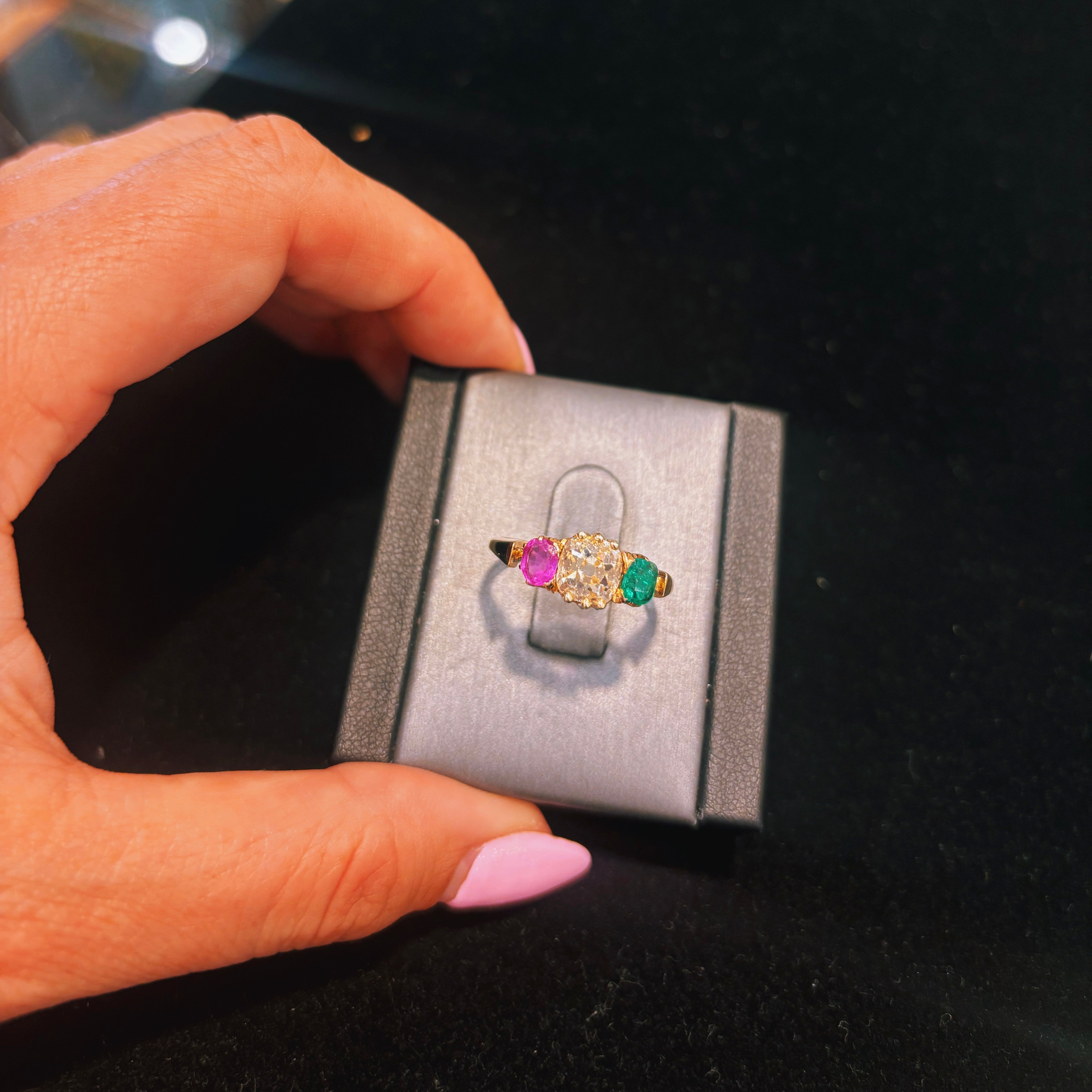 18ct gold old cut diamond, emerald and pink sapphire three stone ring