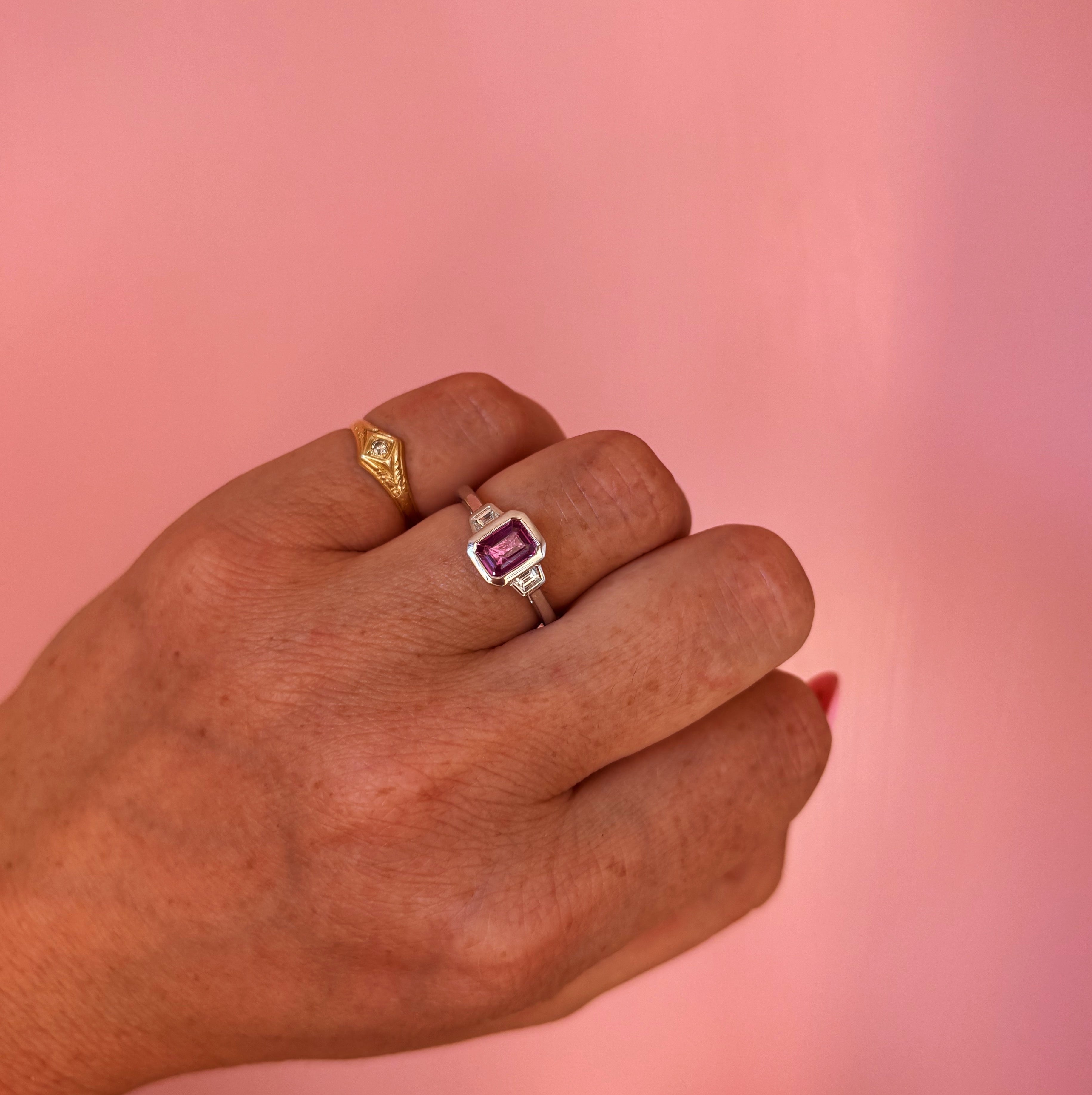 Platinum 0.95ct emerald cut pink sapphire and diamond bezel set ring