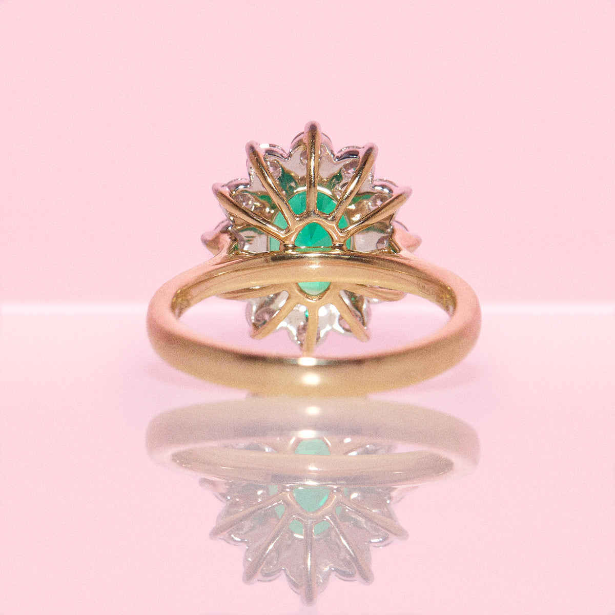 9ct gold 1.93ct oval emerald and 0.88ct diamond cluster ring