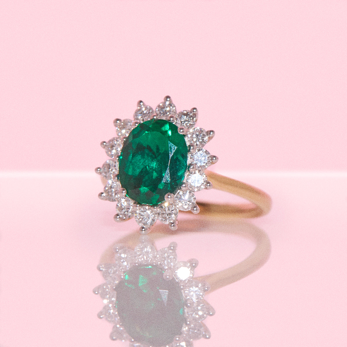 9ct gold 2.28ct oval emerald and 0.83ct diamond cluster ring