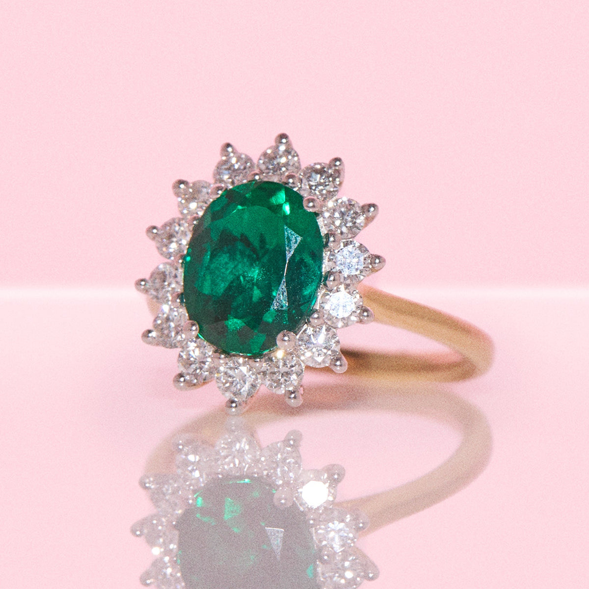 9ct gold 2.28ct oval emerald and 0.83ct diamond cluster ring