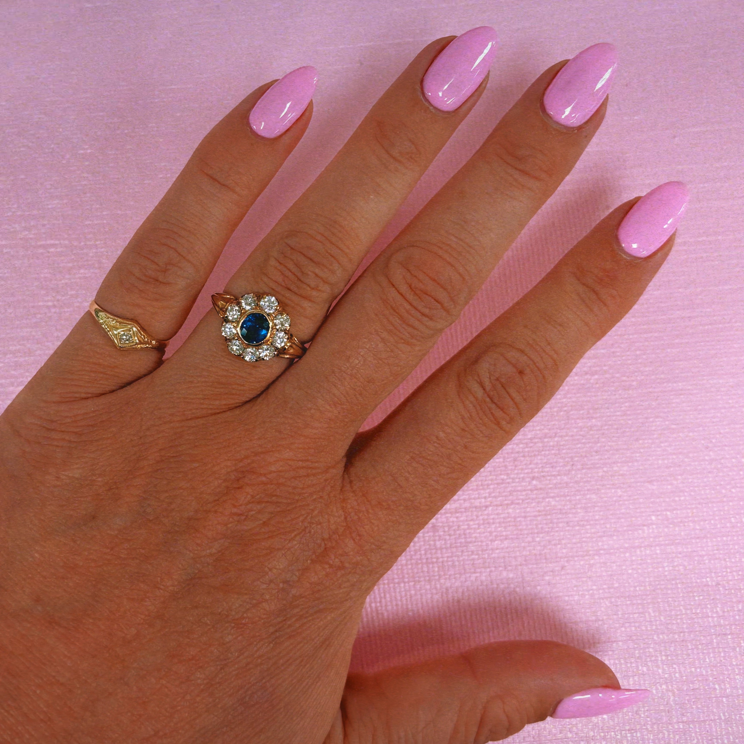 18ct gold bezel set sapphire and old cut diamond cluster ring