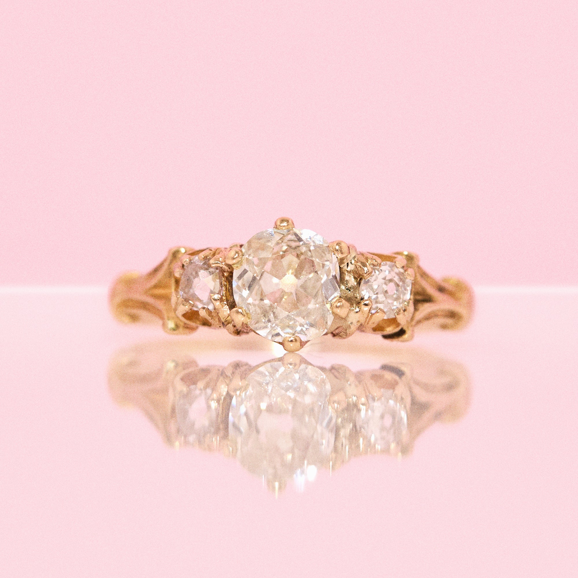 18ct gold old cut diamond three stone ring with carved shoulders