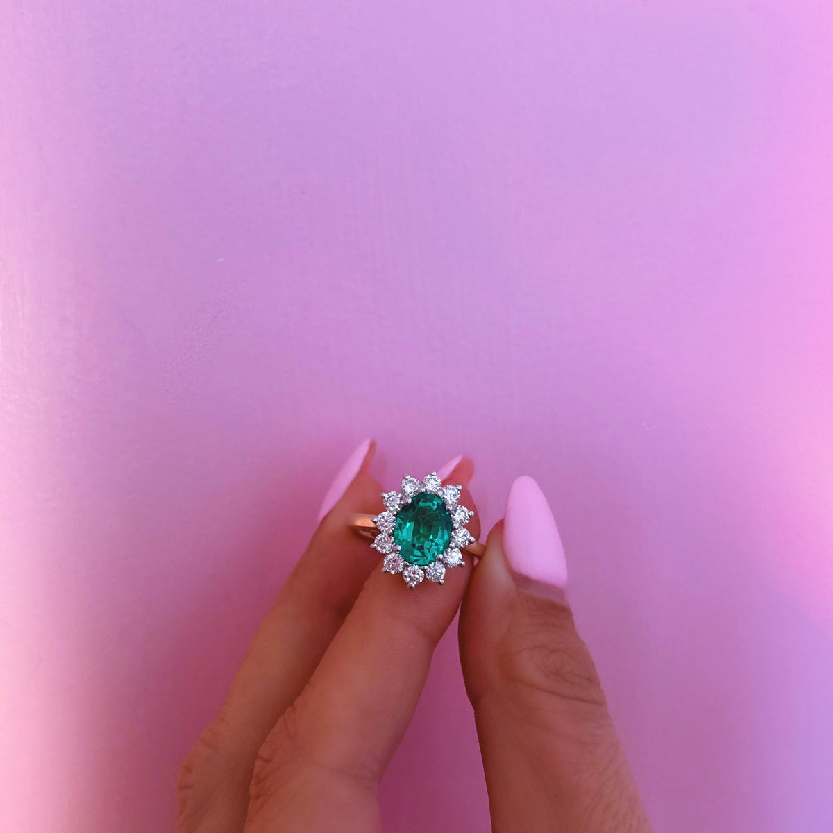 9ct gold 1.93ct oval emerald and 0.88ct diamond cluster ring