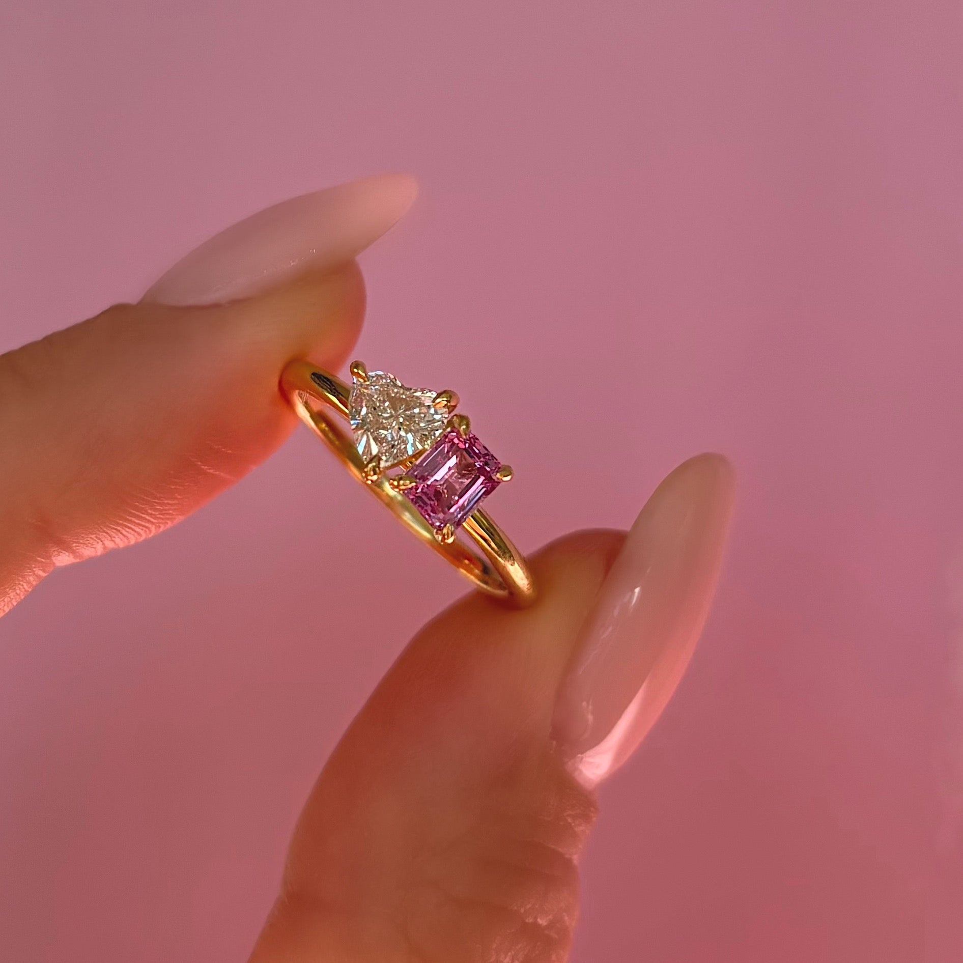 18ct gold ‘toi et moi’ 0.46ct heart-shaped diamond and 0.60ct pink sapphire ring (made to order)