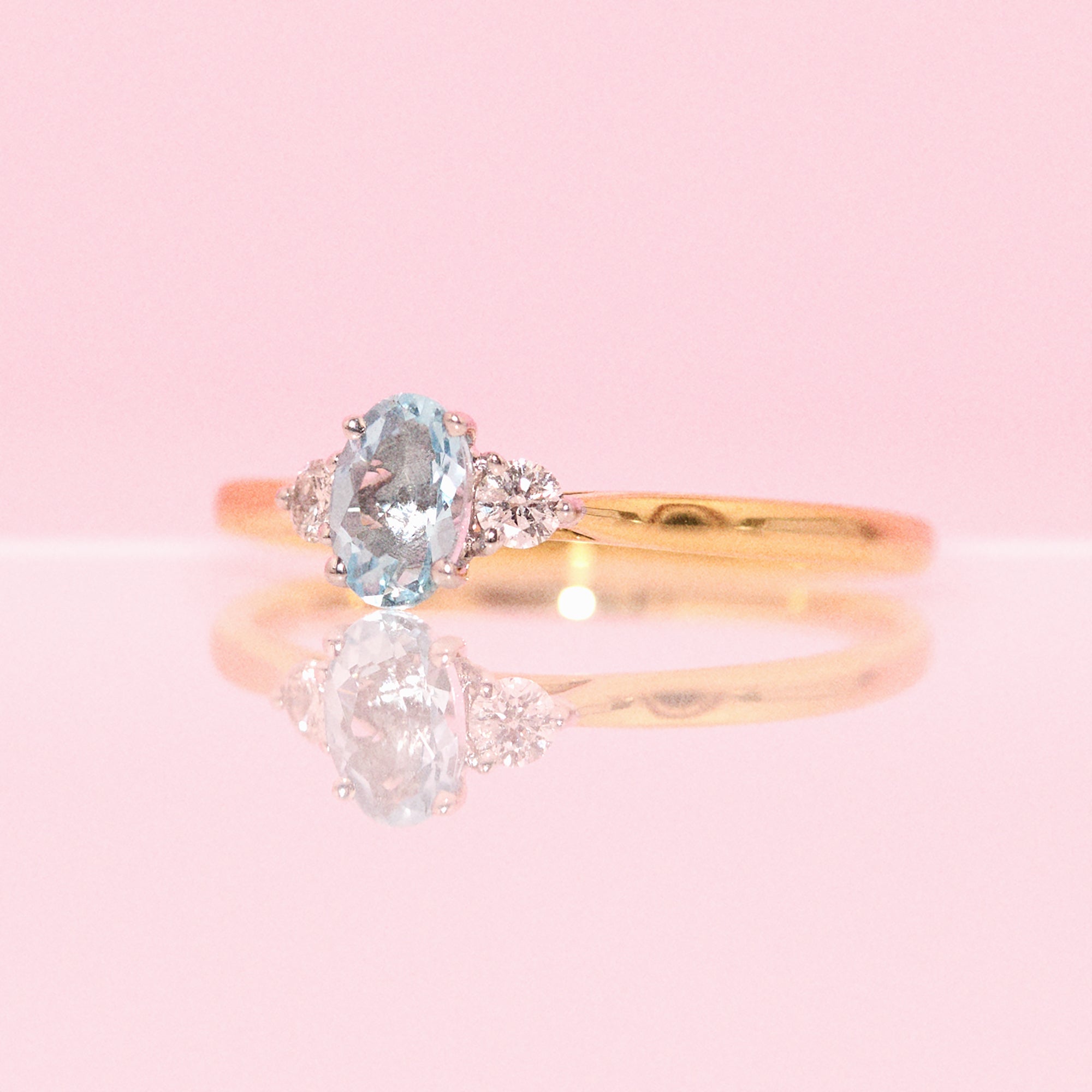 18ct gold 0.21ct oval aquamarine and diamond three stone ring (made to order)