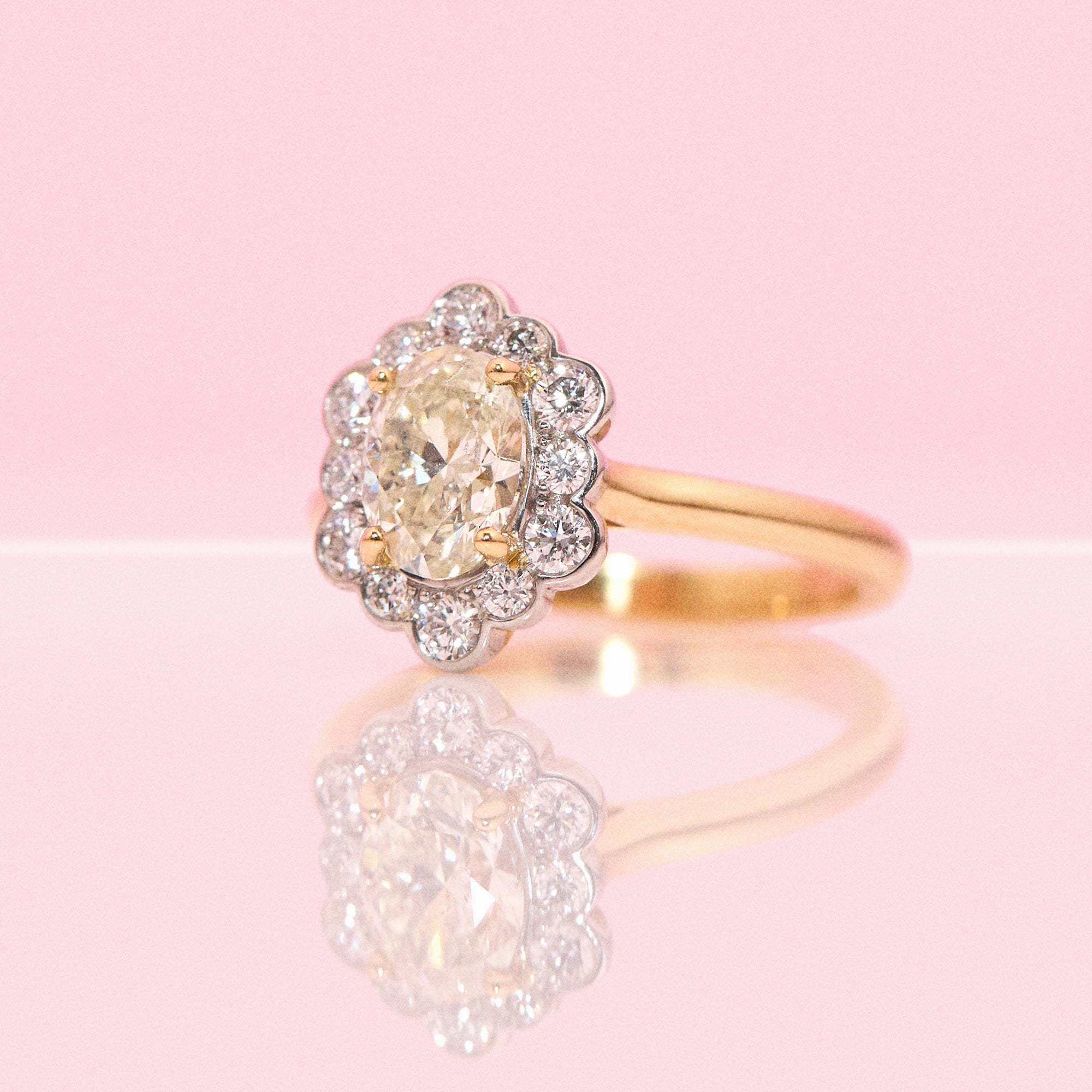 18ct gold 1.20ct oval diamond flower ring