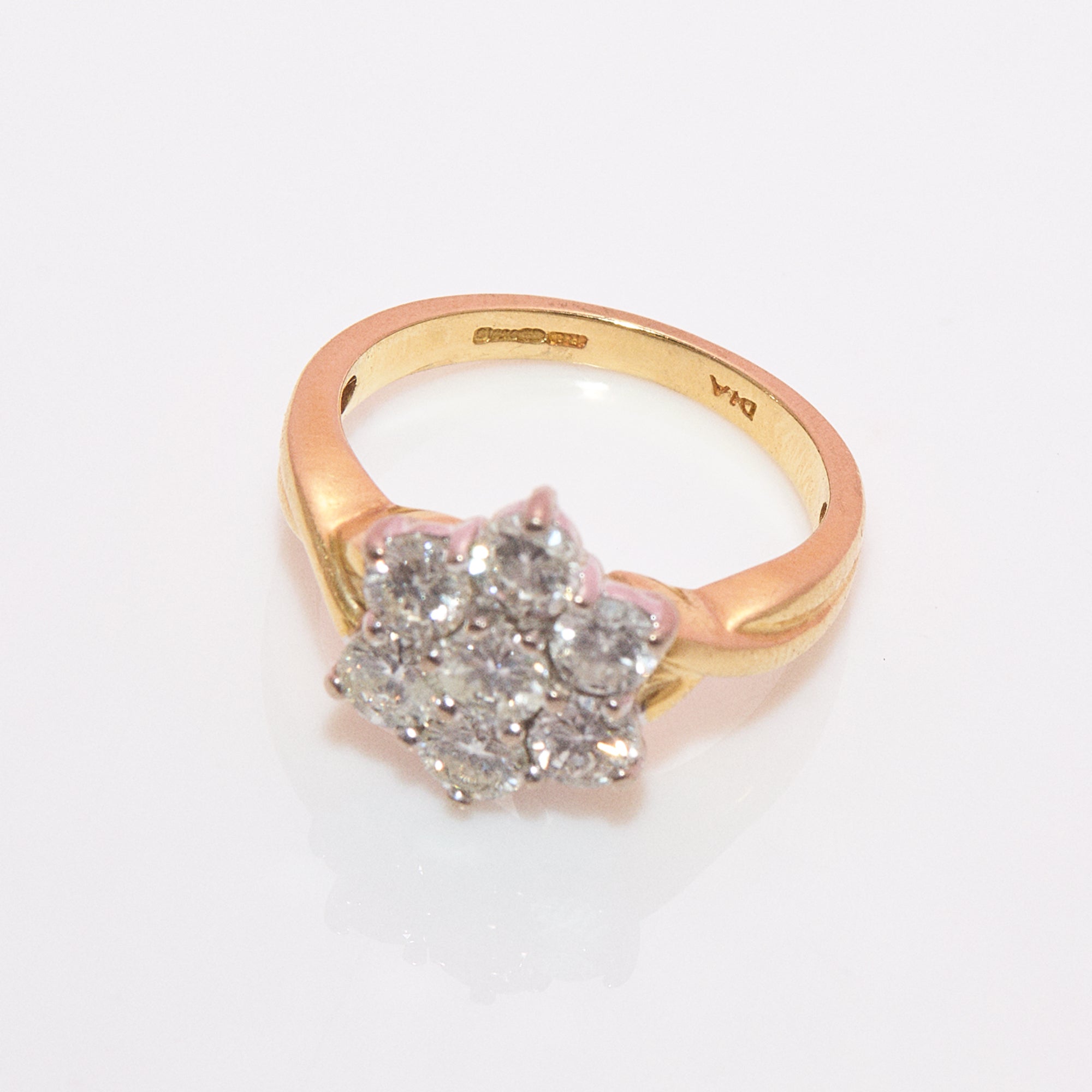 18ct gold diamond flower ring with a twisted band