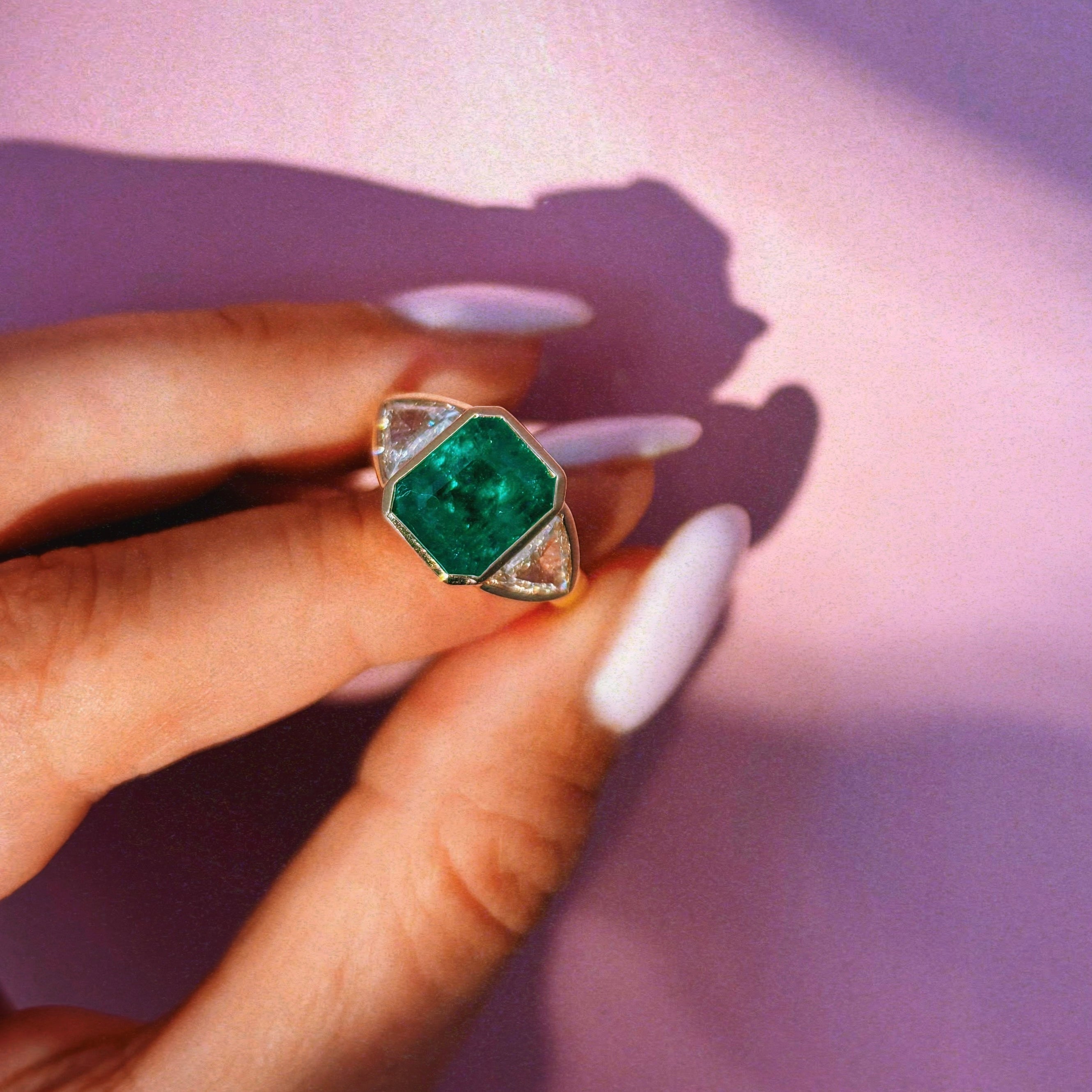 18ct gold 3.0ct Columbian Octagonal-cut emerald and 1.0ct diamond bezel set ring