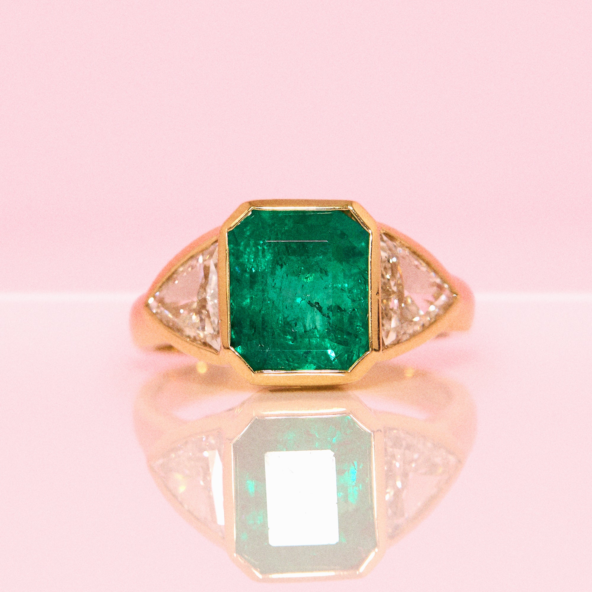 18ct gold 3.0ct Columbian Octagonal-cut emerald and 1.0ct diamond bezel set ring