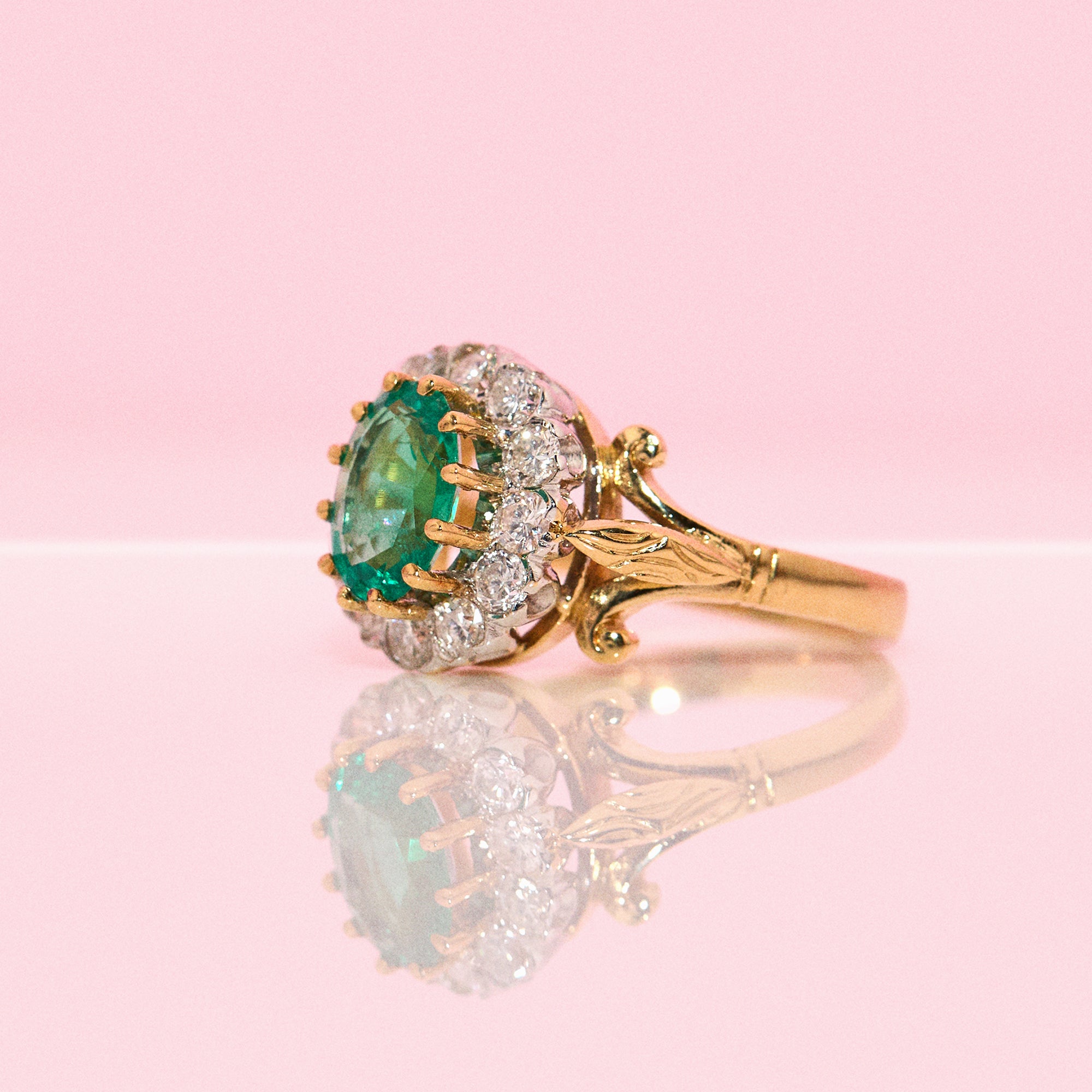 18ct gold 1.46ct emerald and diamond cluster ring