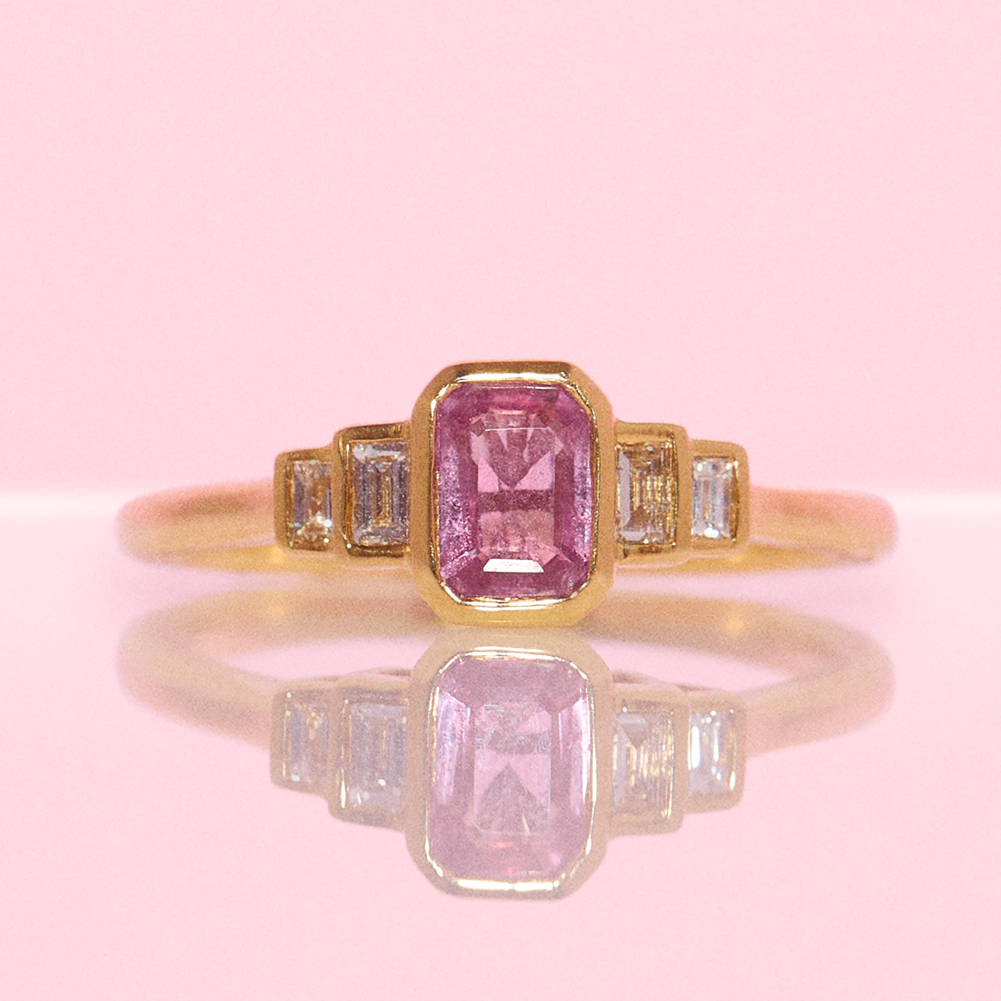 18ct gold 0.72ct emerald cut pink sapphire and 0.13ct diamond ring