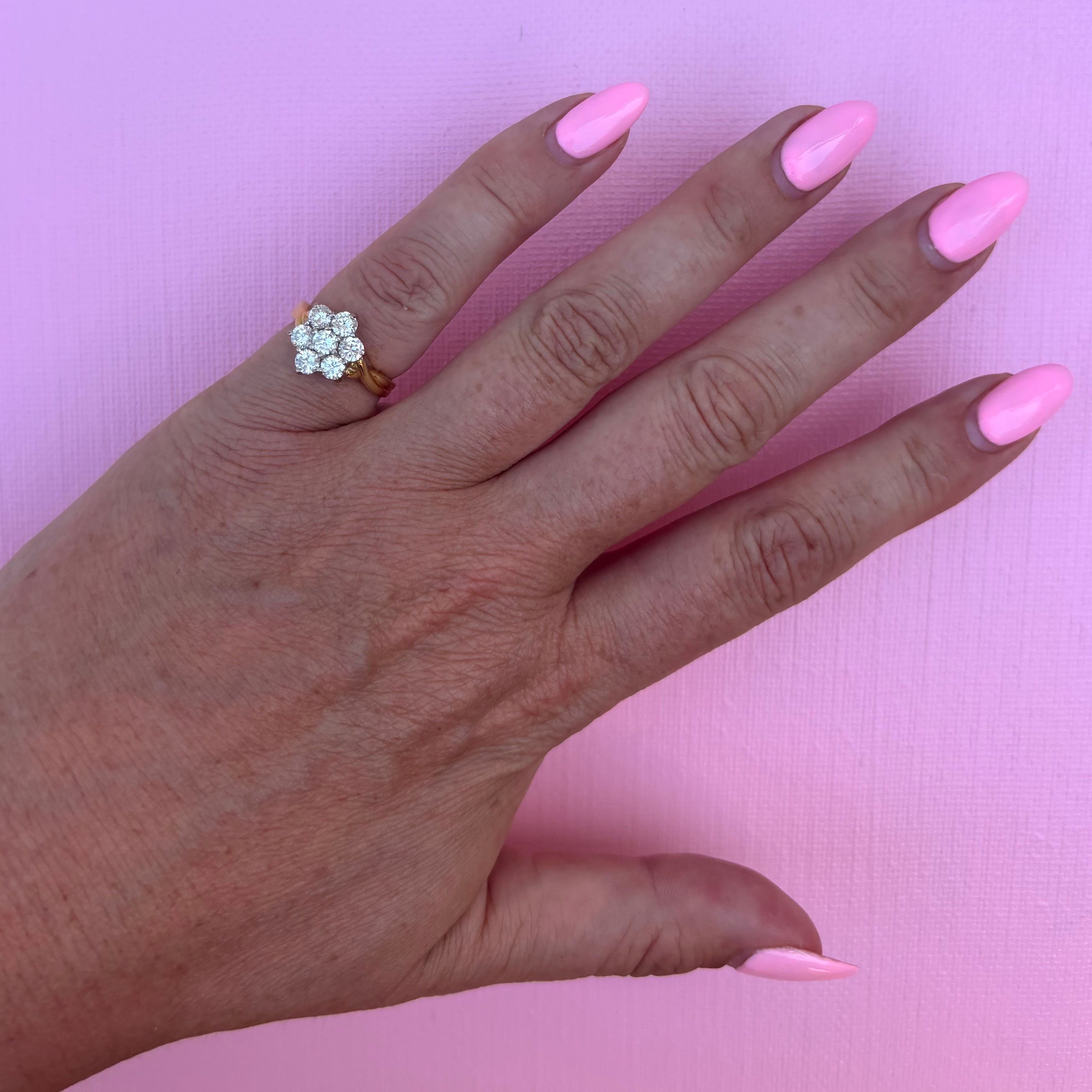 18ct gold diamond flower ring with a twisted band