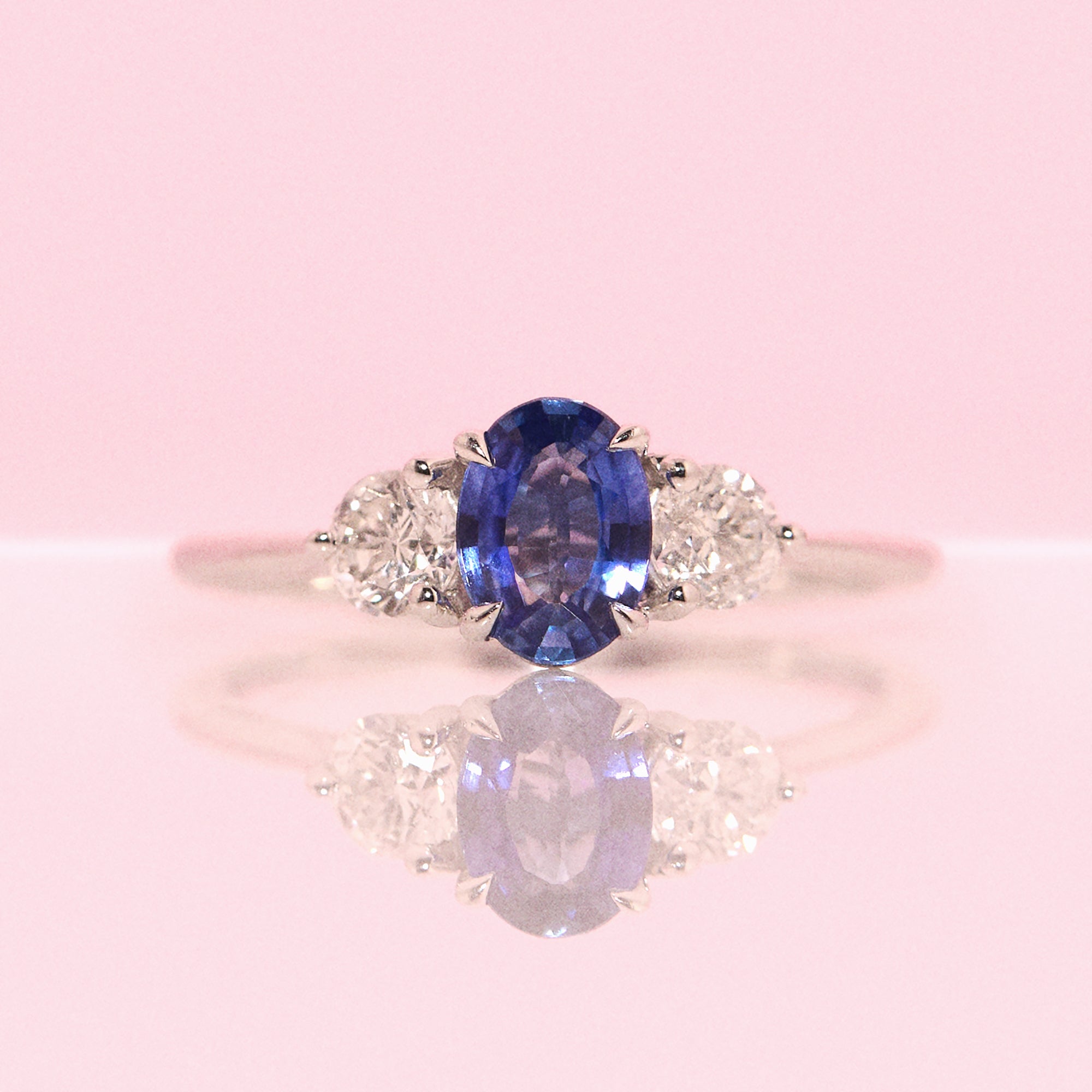 Platinum 0.84ct blue sapphire and diamond three stone ring (made to order)