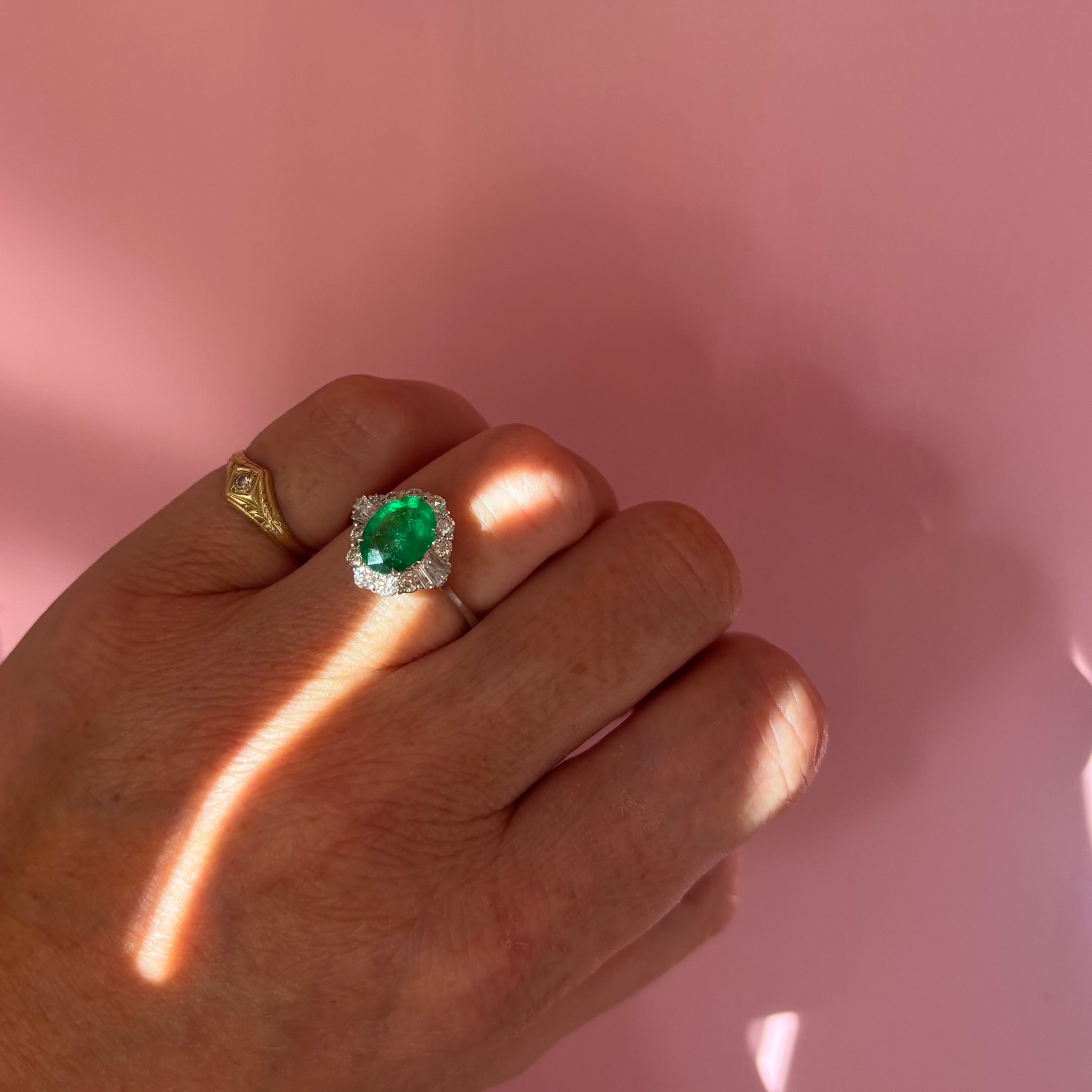 18ct white gold oval emerald and baguette diamond cluster ring