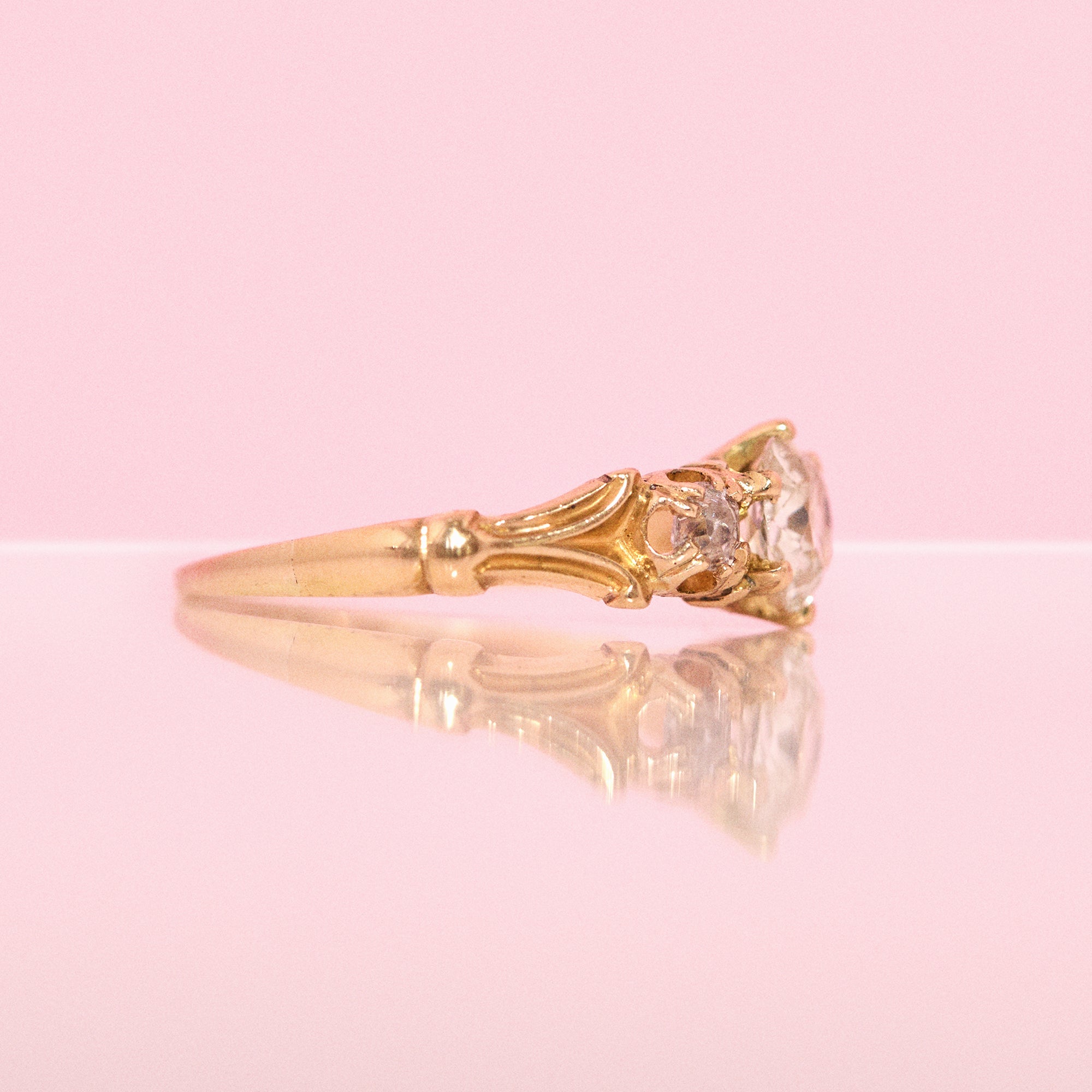18ct gold old cut diamond three stone ring with carved shoulders