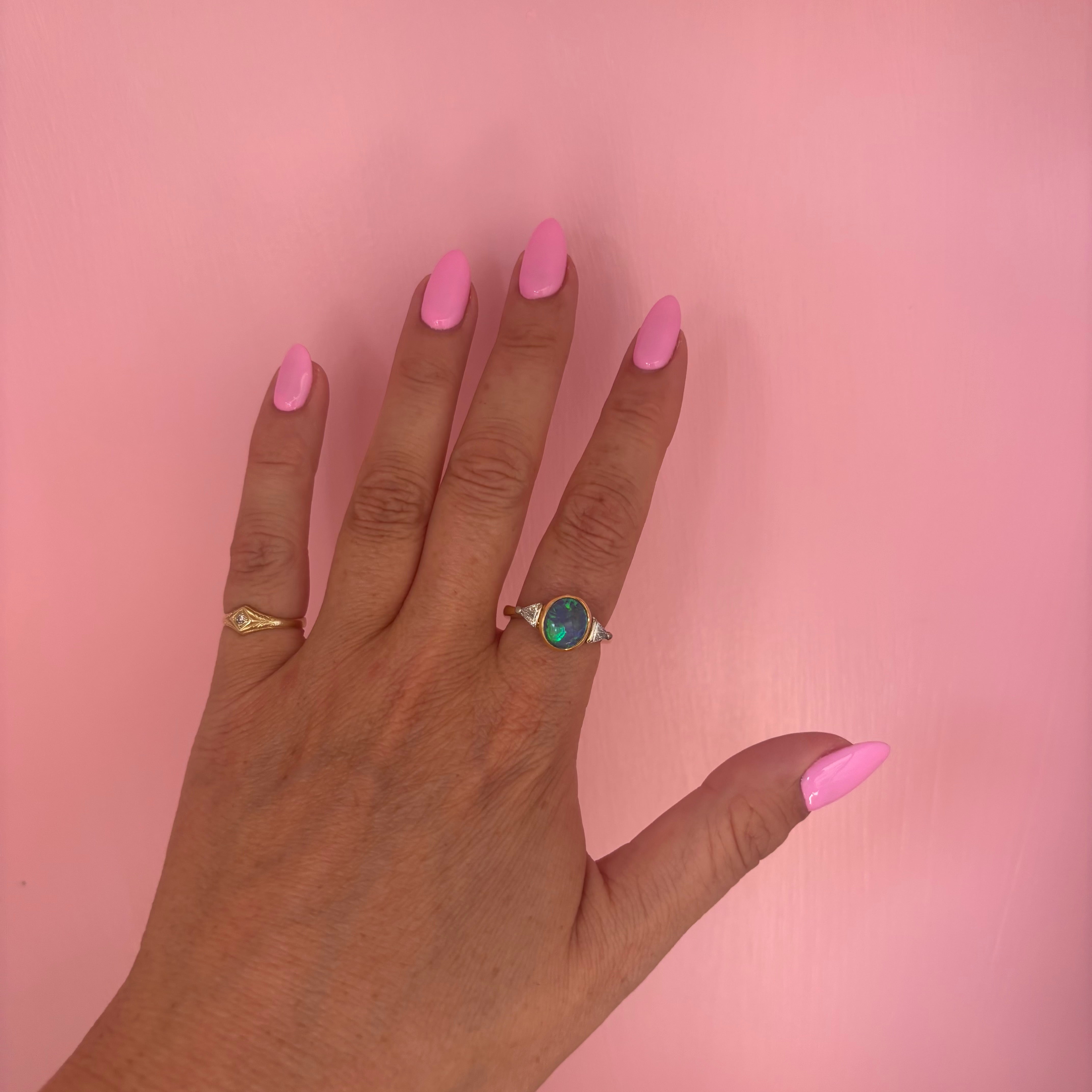 18ct gold bezel set black opal and diamond ring
