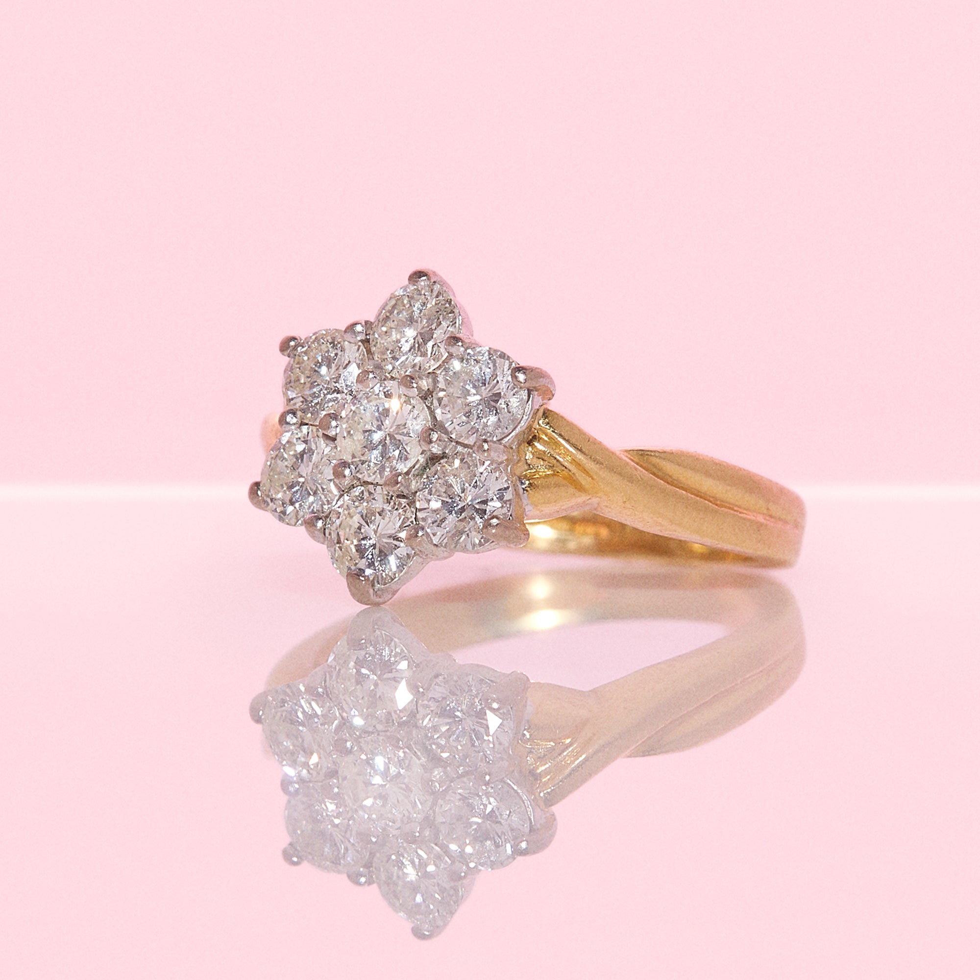 18ct gold diamond flower ring with a twisted band