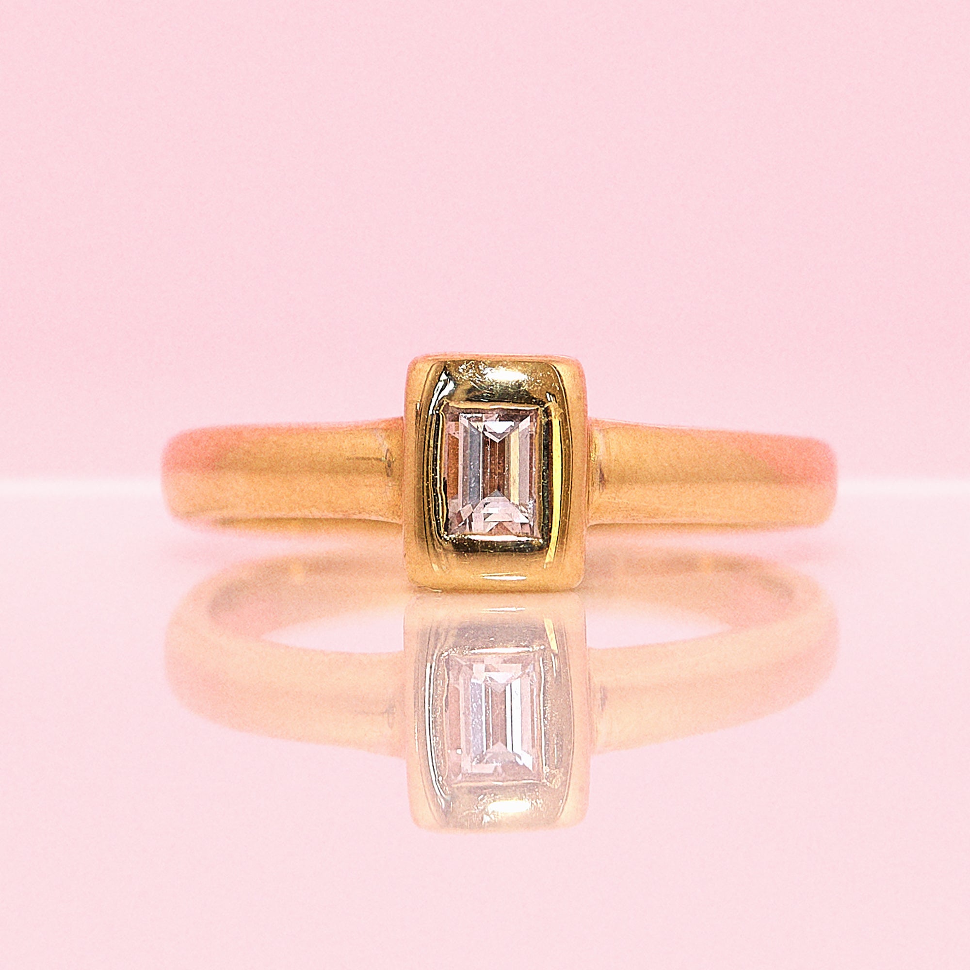 18ct gold bezel set emerald cut 0.25ct diamond ring