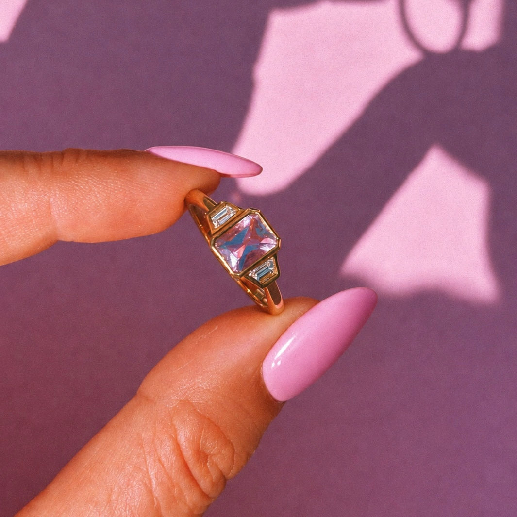 9ct gold 0.94ct emerald cut amethyst and 0.17ct diamond ring