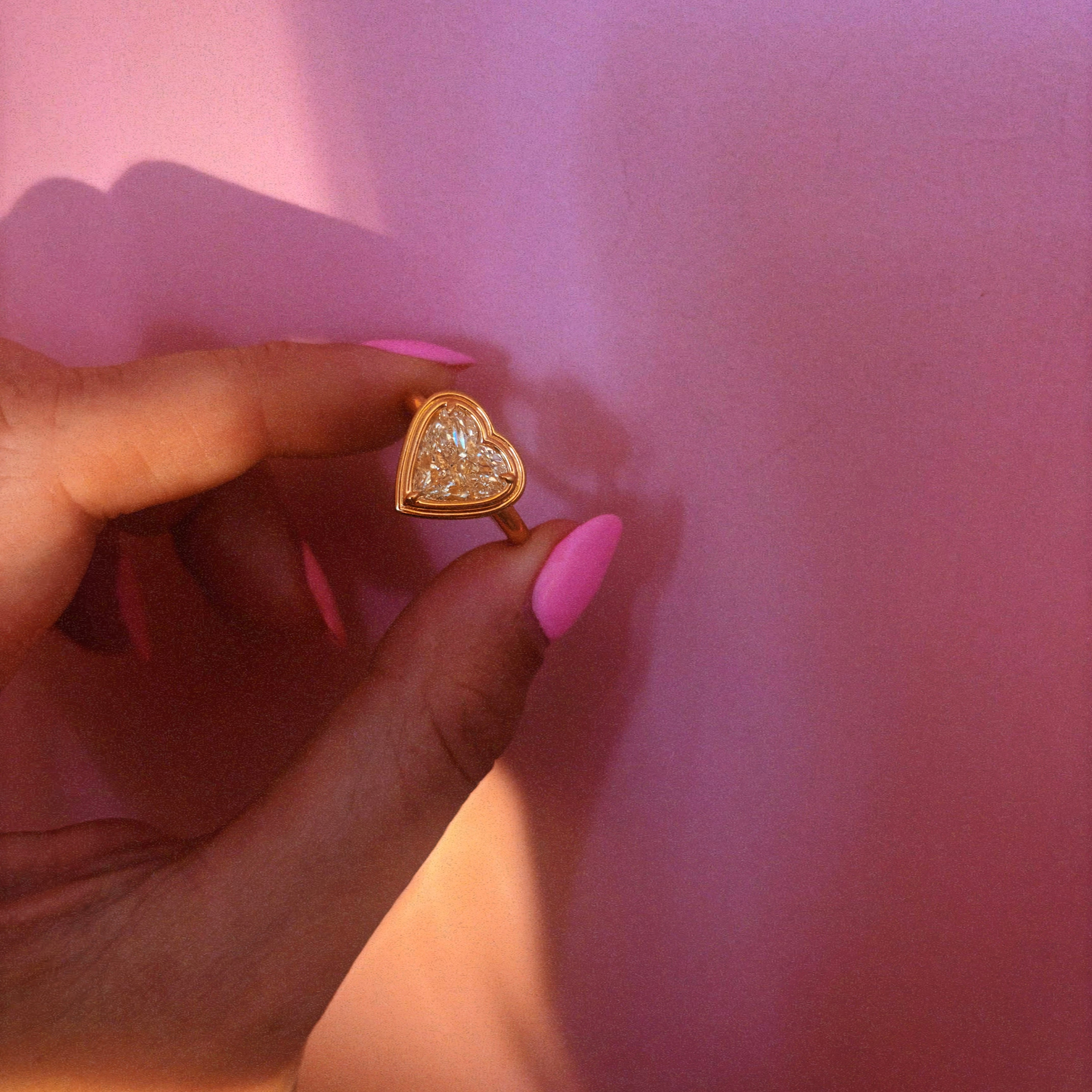 18ct gold bezel set fancy yellow 2.35ct heart-shaped diamond ring