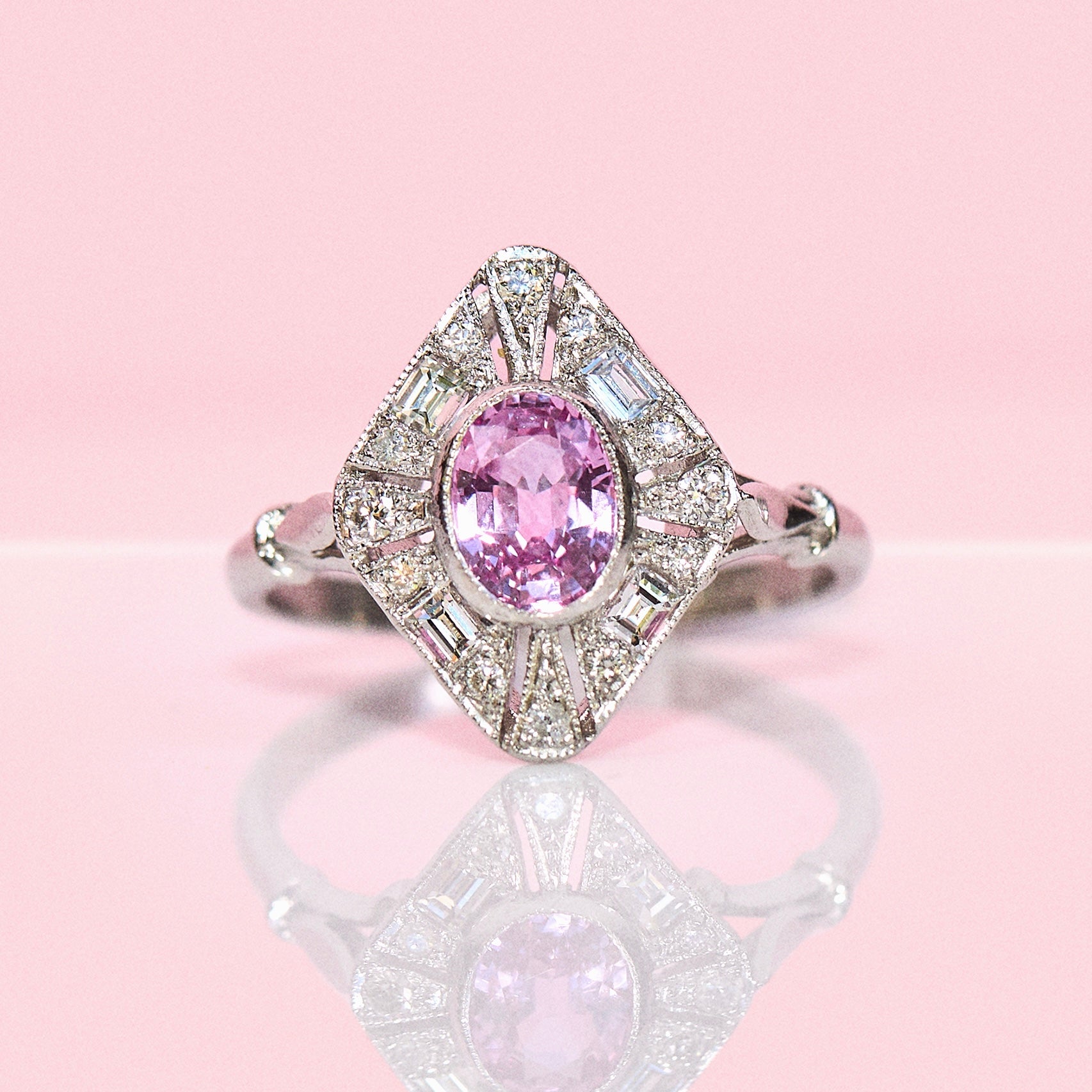 Platinum pink sapphire and diamond cluster ring
