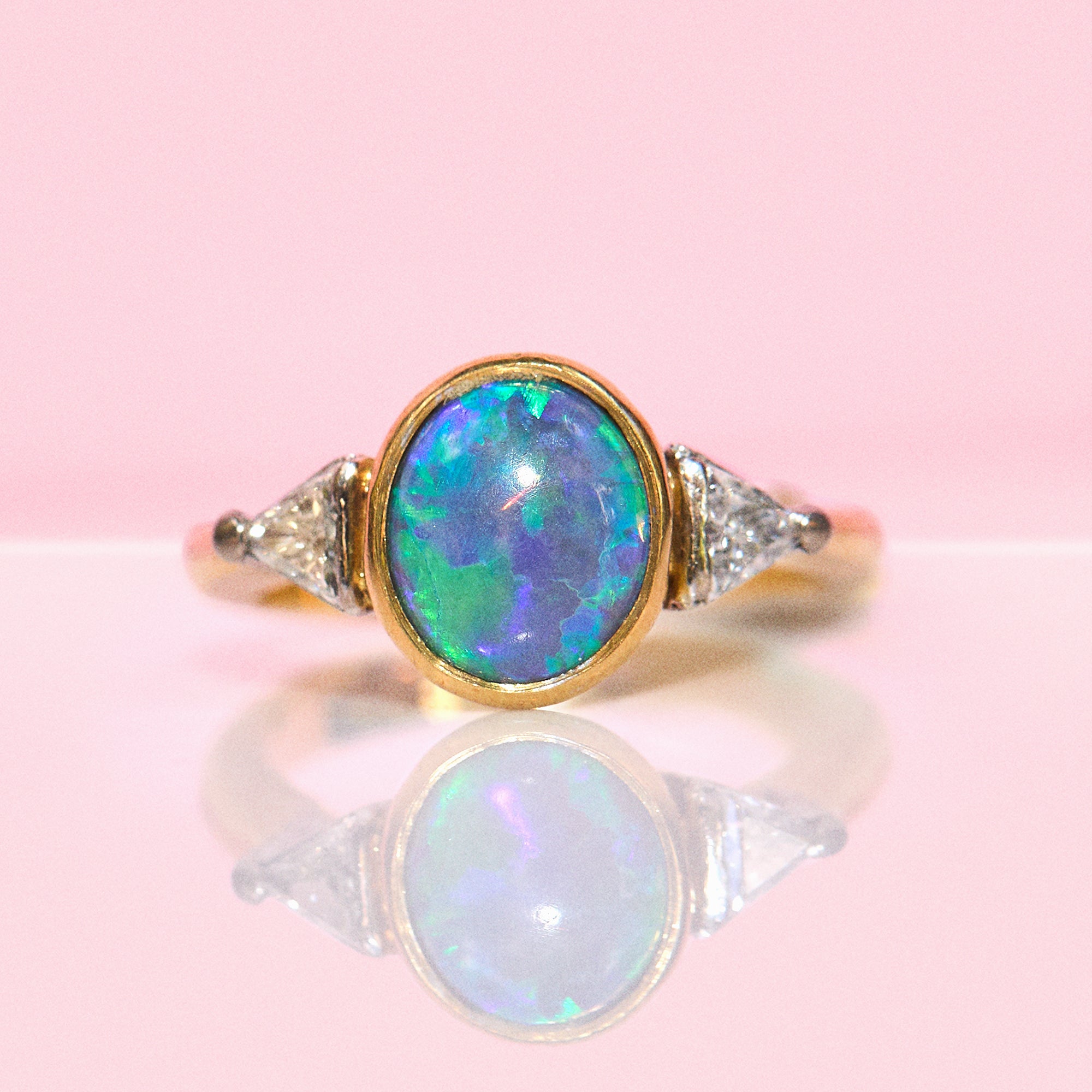 18ct gold bezel set black opal and diamond ring