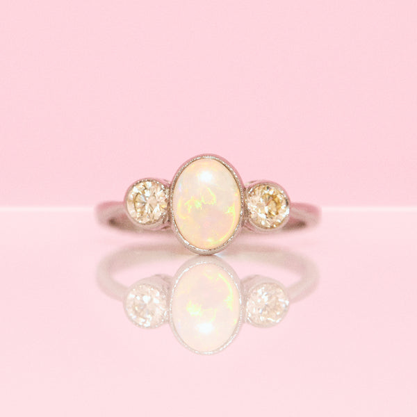 Platinum opal and diamond three stone ring