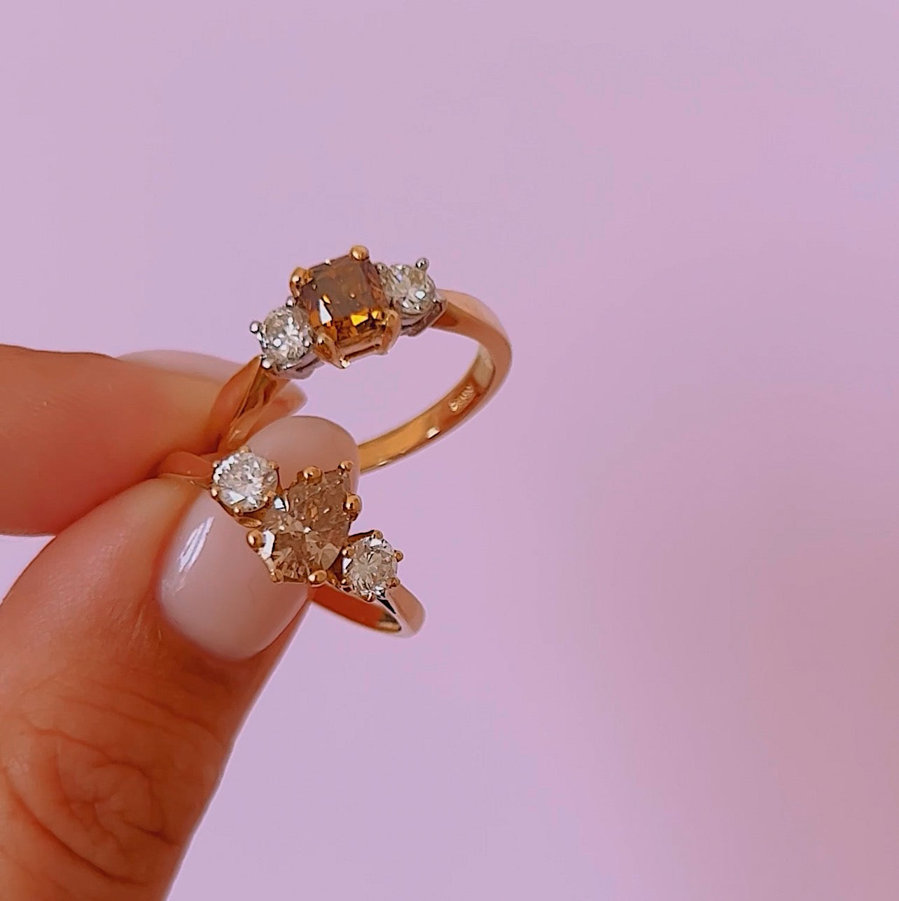 18ct gold three stone ring with a 1.10ct pear shaped yellow diamond centre stone