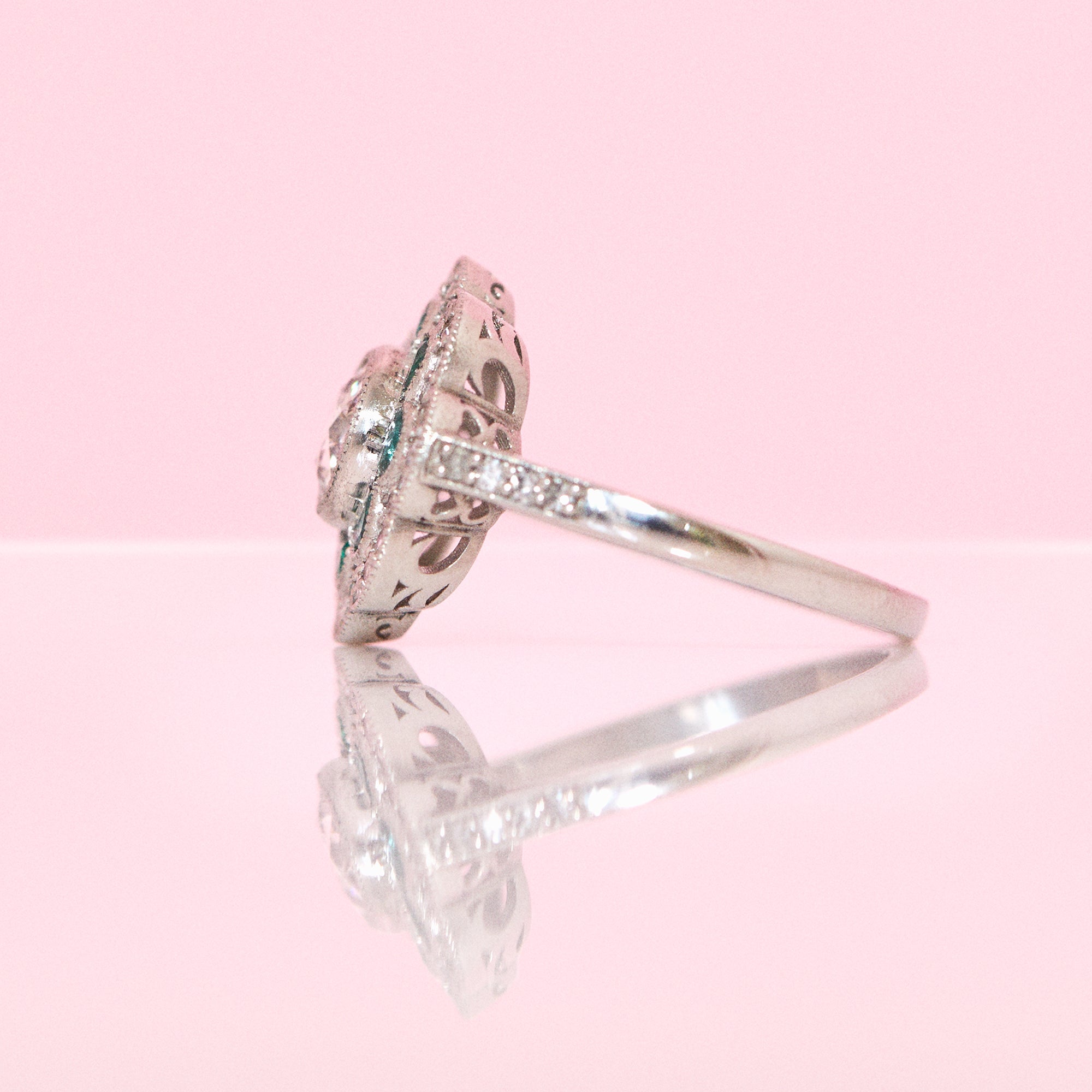 Platinum emerald and diamond flower ring