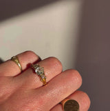 18ct gold diamond three stone ring with carved shoulders