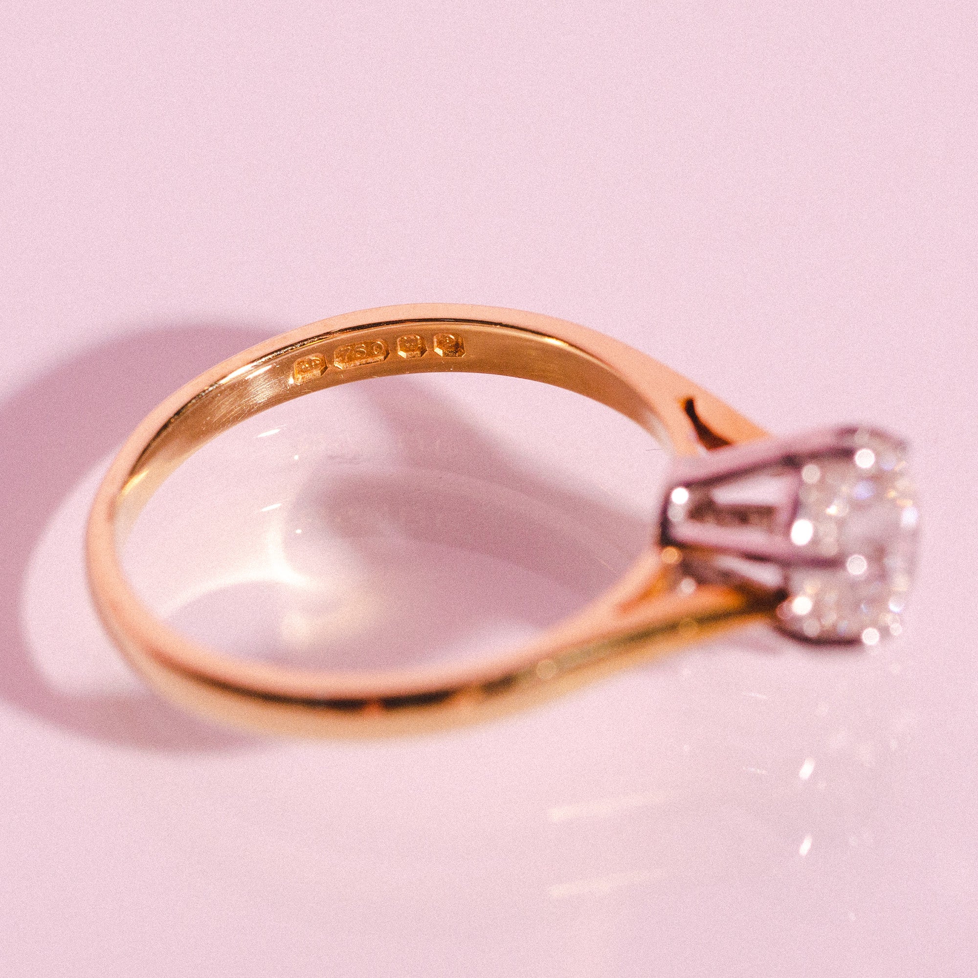 18ct yellow gold ring set with one diamond