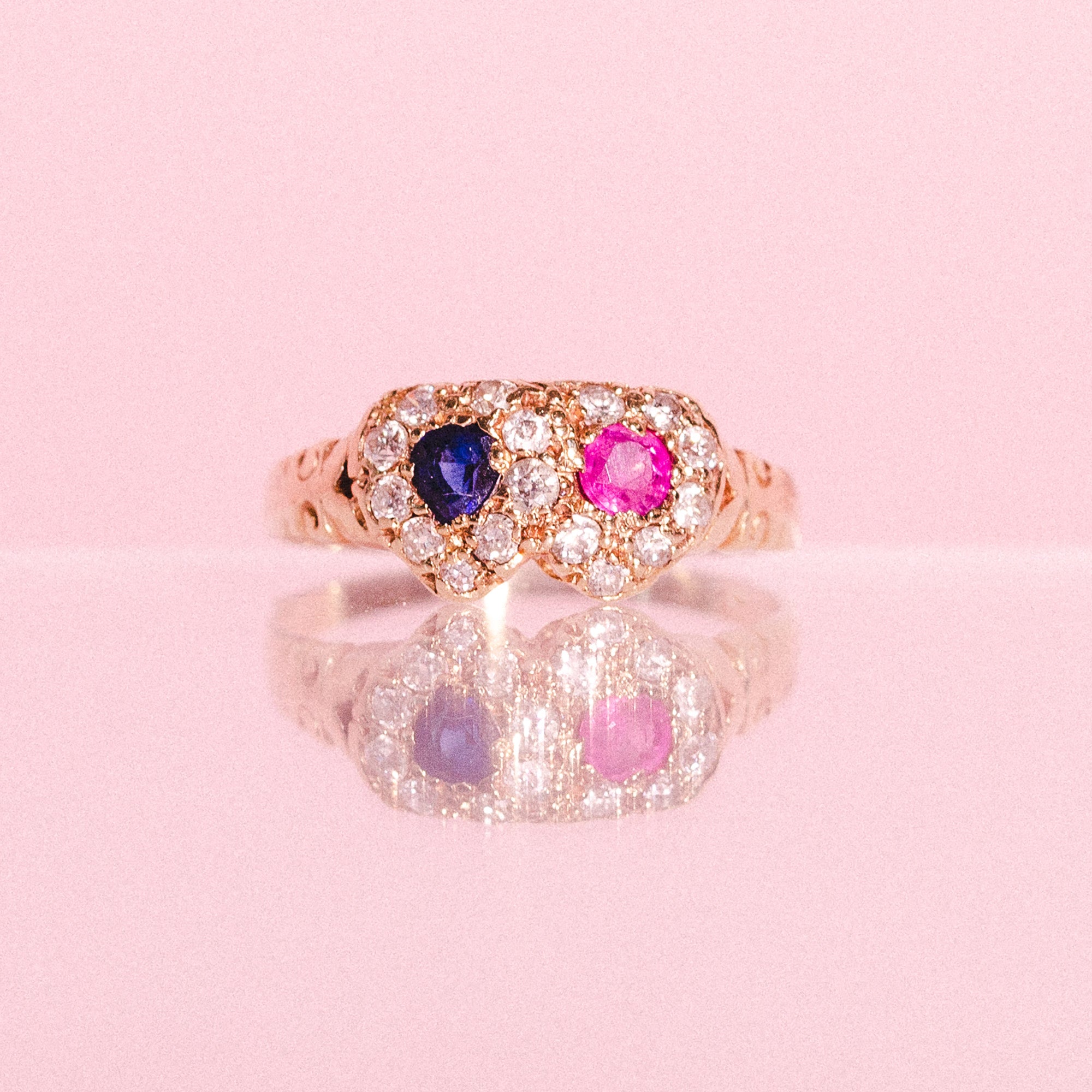 18ct gold love ring set with a ruby, a sapphire and diamonds