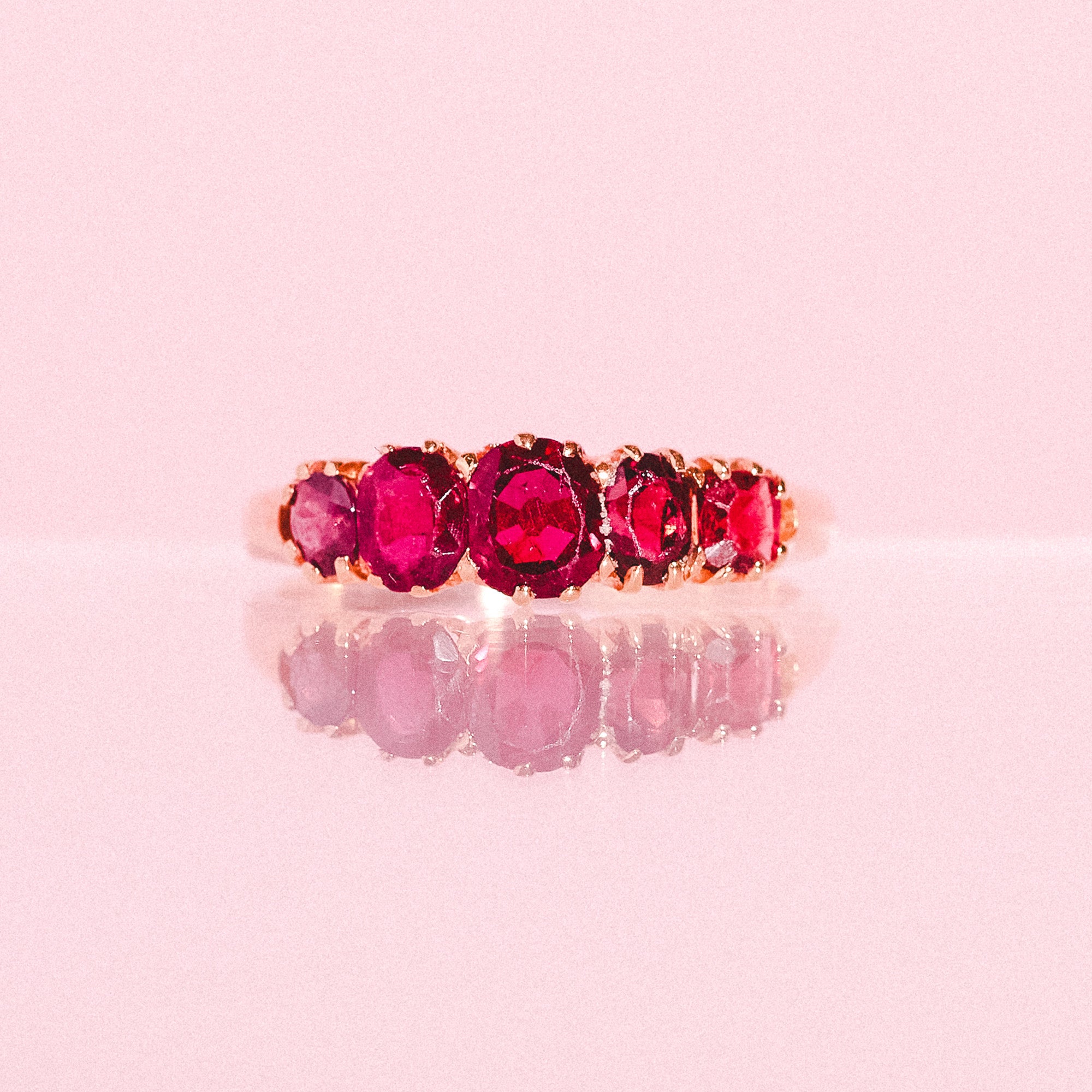 14ct gold ring set with five garnets