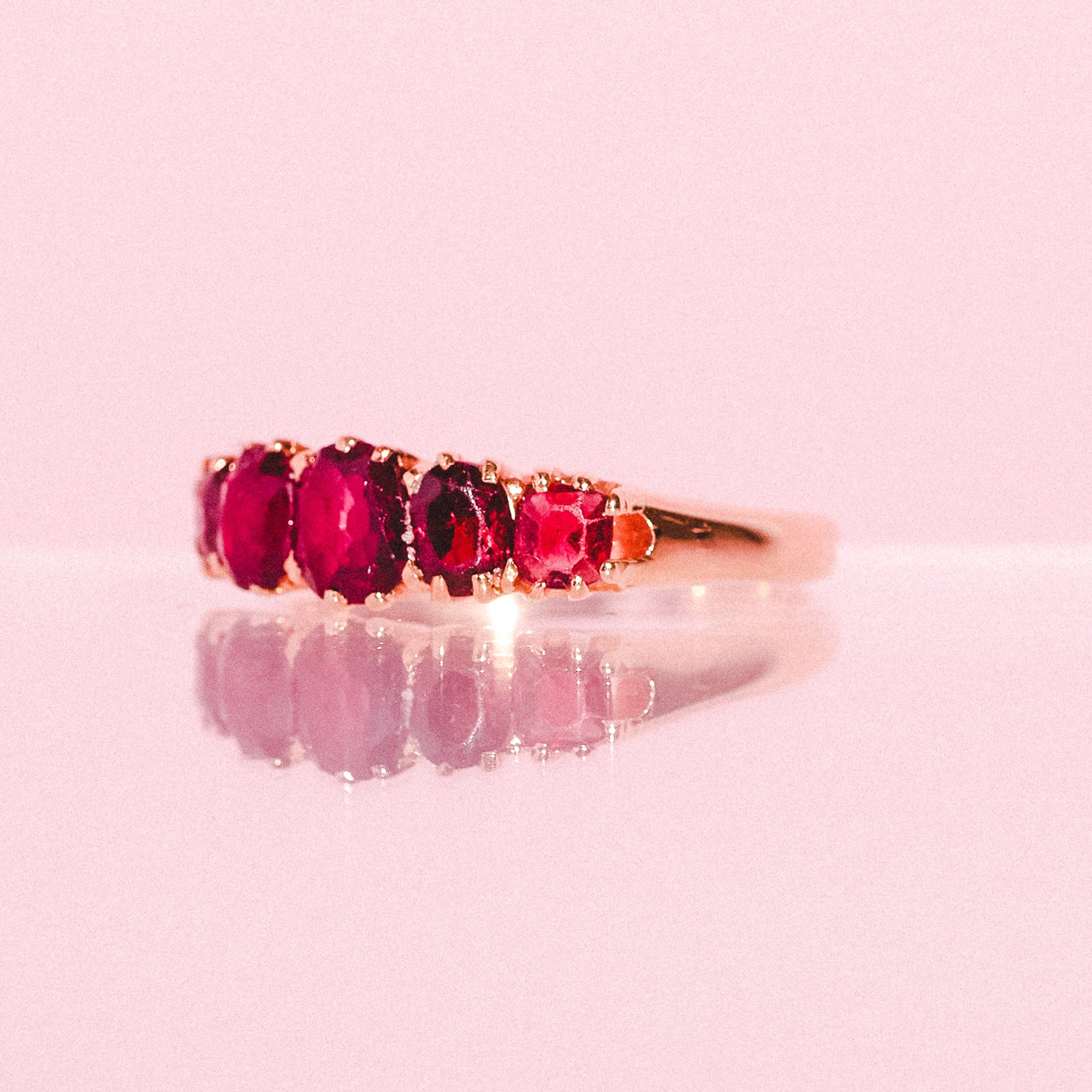 14ct gold ring set with five garnets