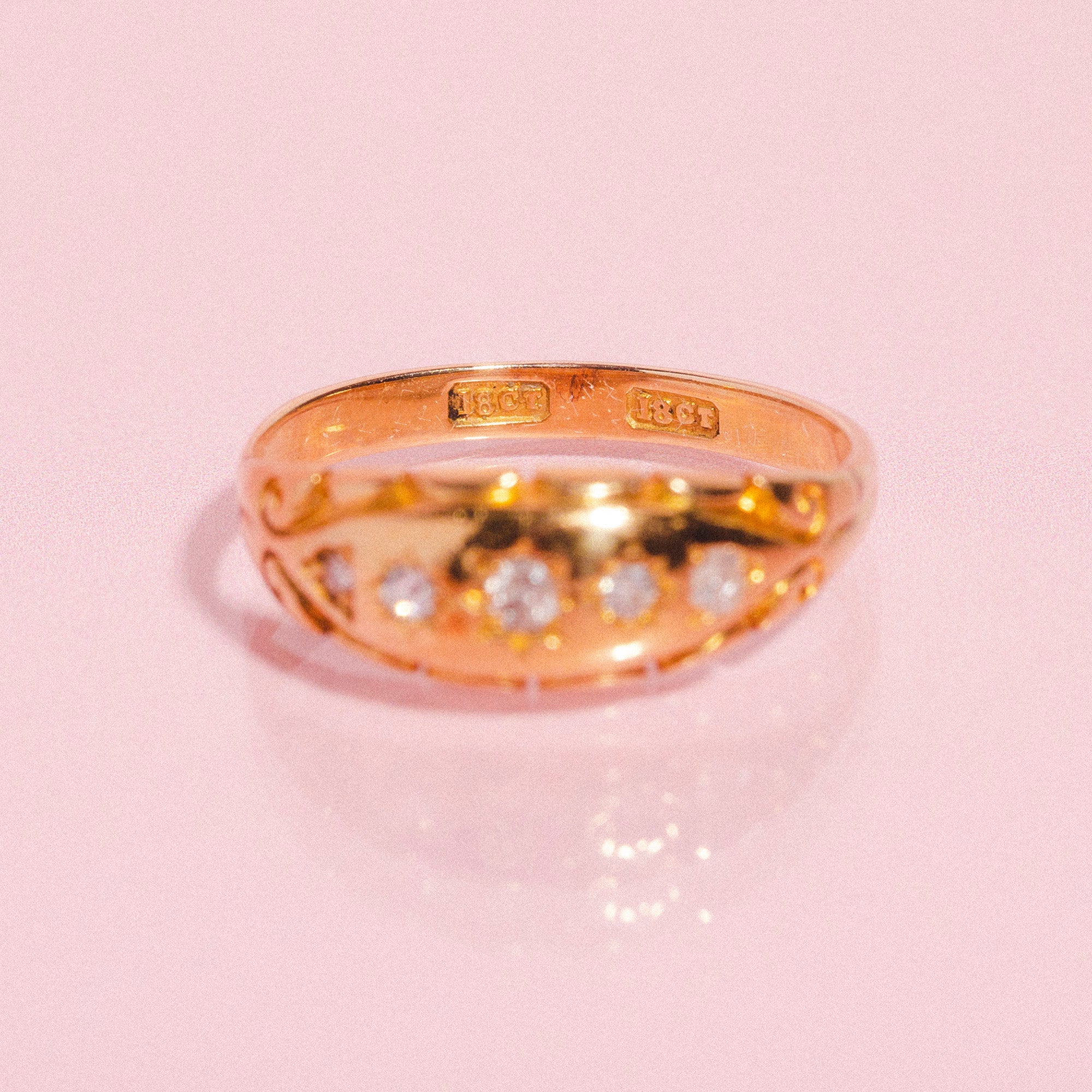 18ct gold gypsy ring set with five diamonds in a carved band
