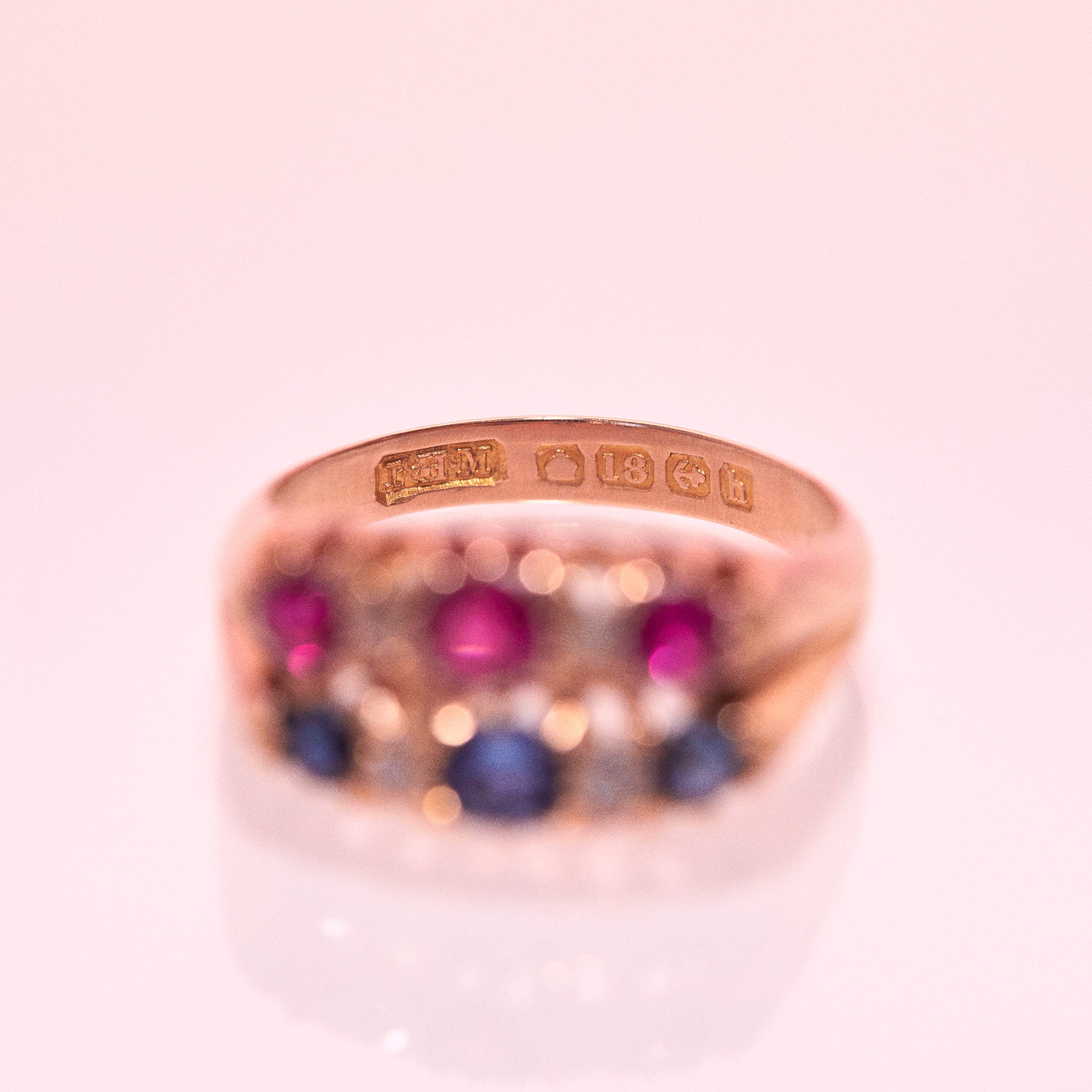 18ct gold ring set with sapphires, rubies and diamonds