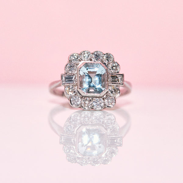 Platinum ring set with an aquamarine and diamonds