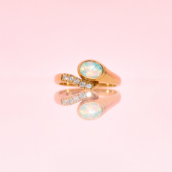 18ct gold snake ring set with an opal and diamonds