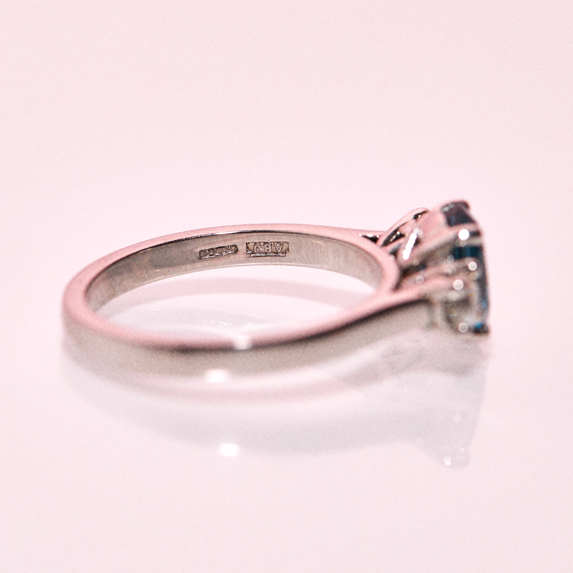 Platinum ring set with a blue topaz and a diamonds