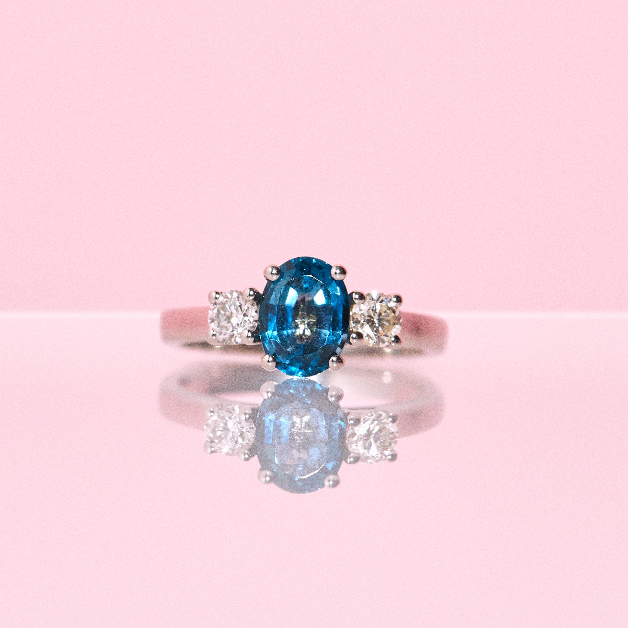 Platinum ring set with a blue topaz and a diamonds