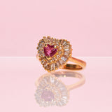 14ct gold ring set with a heart shaped ruby and diamonds