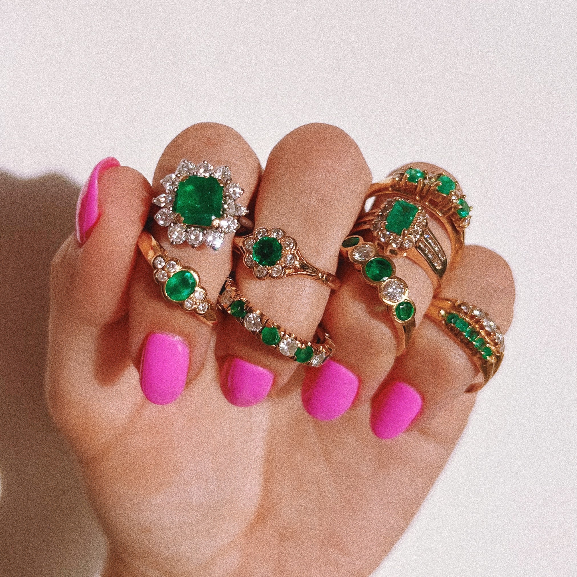 18ct gold ring set with emeralds and diamonds