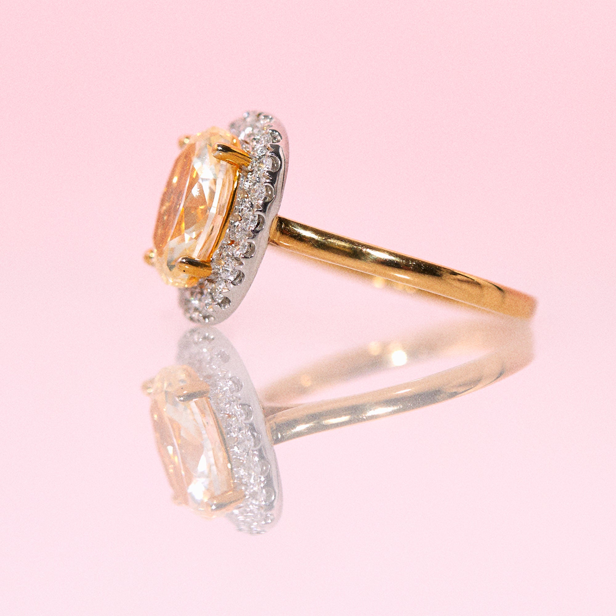 18ct gold yellow diamond ring with a diamond halo