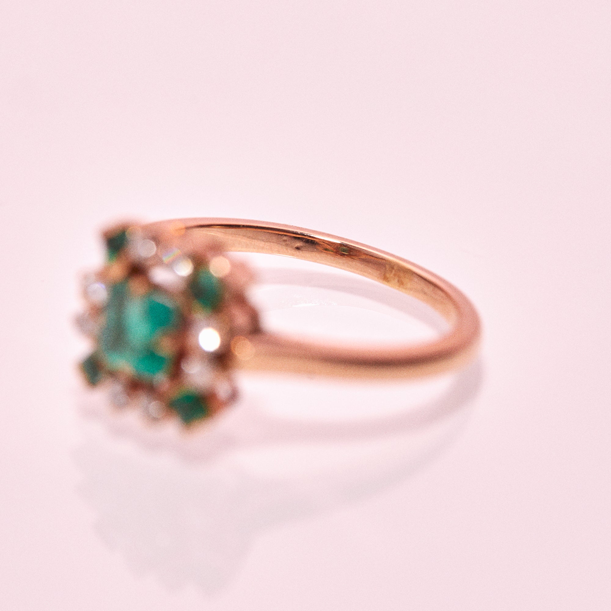 18ct gold ring set with emeralds and diamonds