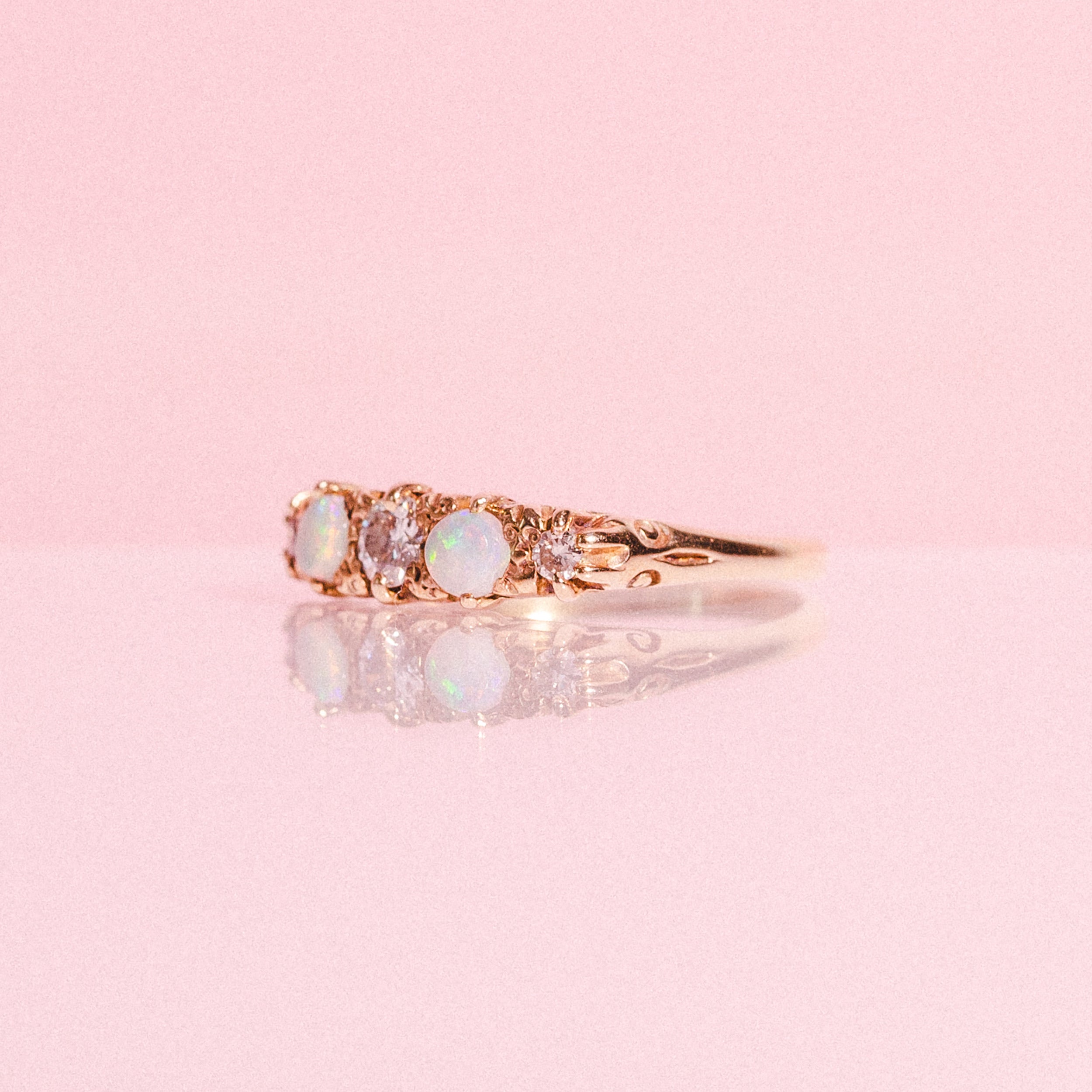 18ct gold ring set with opals and diamonds