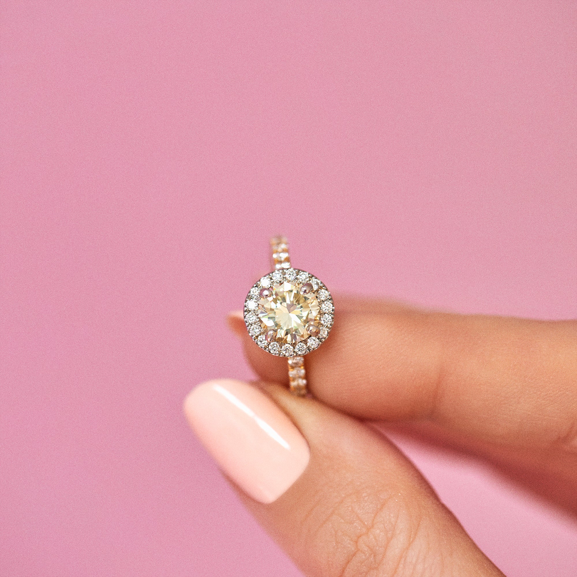 18ct yellow gold yellow diamond ring set with a diamond halo