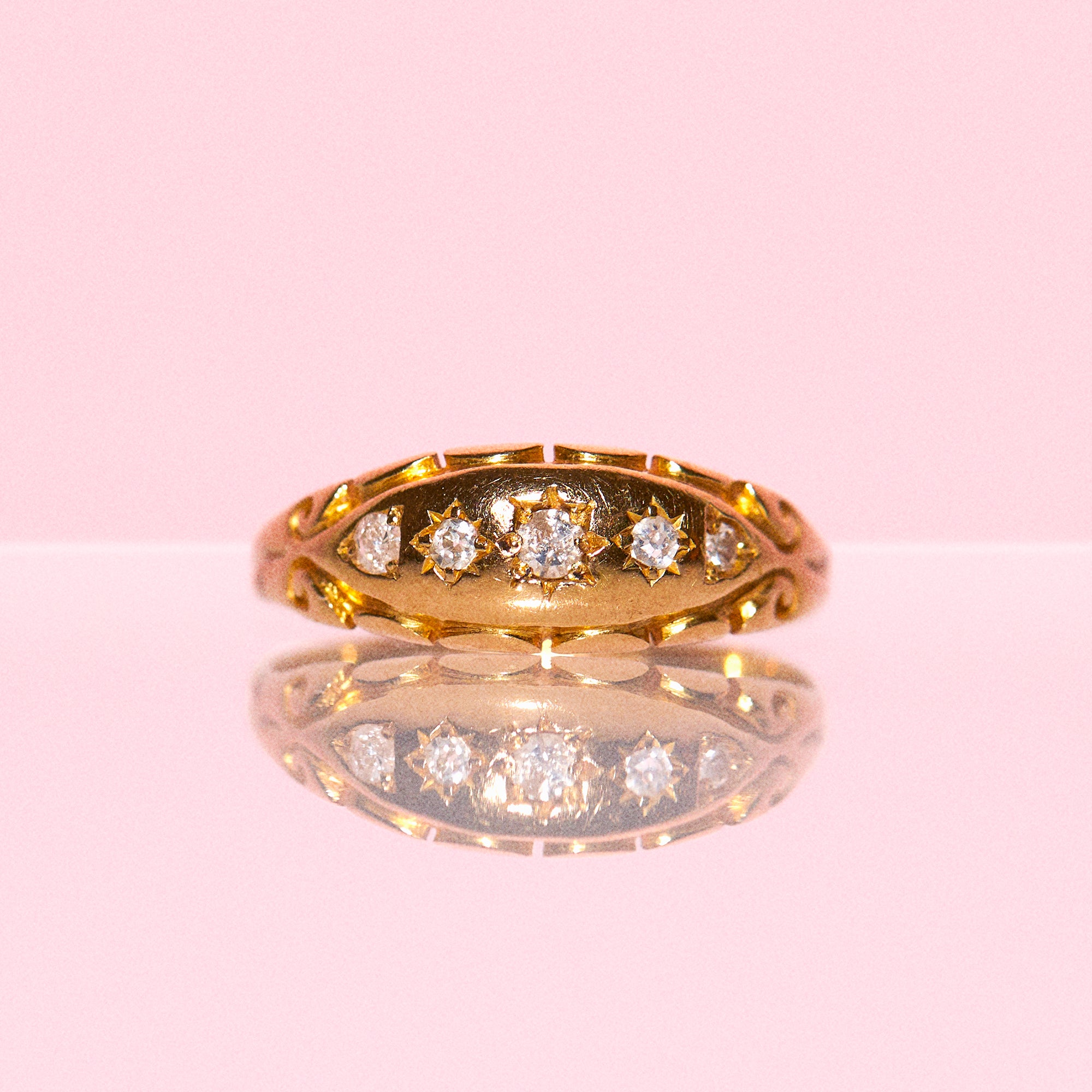 18ct gold gypsy ring set with five diamonds in a carved band